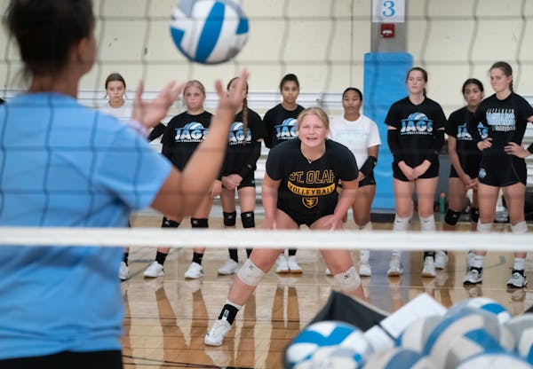 Head Jefferson H.S. volleyball coach Crystal Dohlman, left, asked Olivia Opstad to demonstrate a drill on the first day of practice.