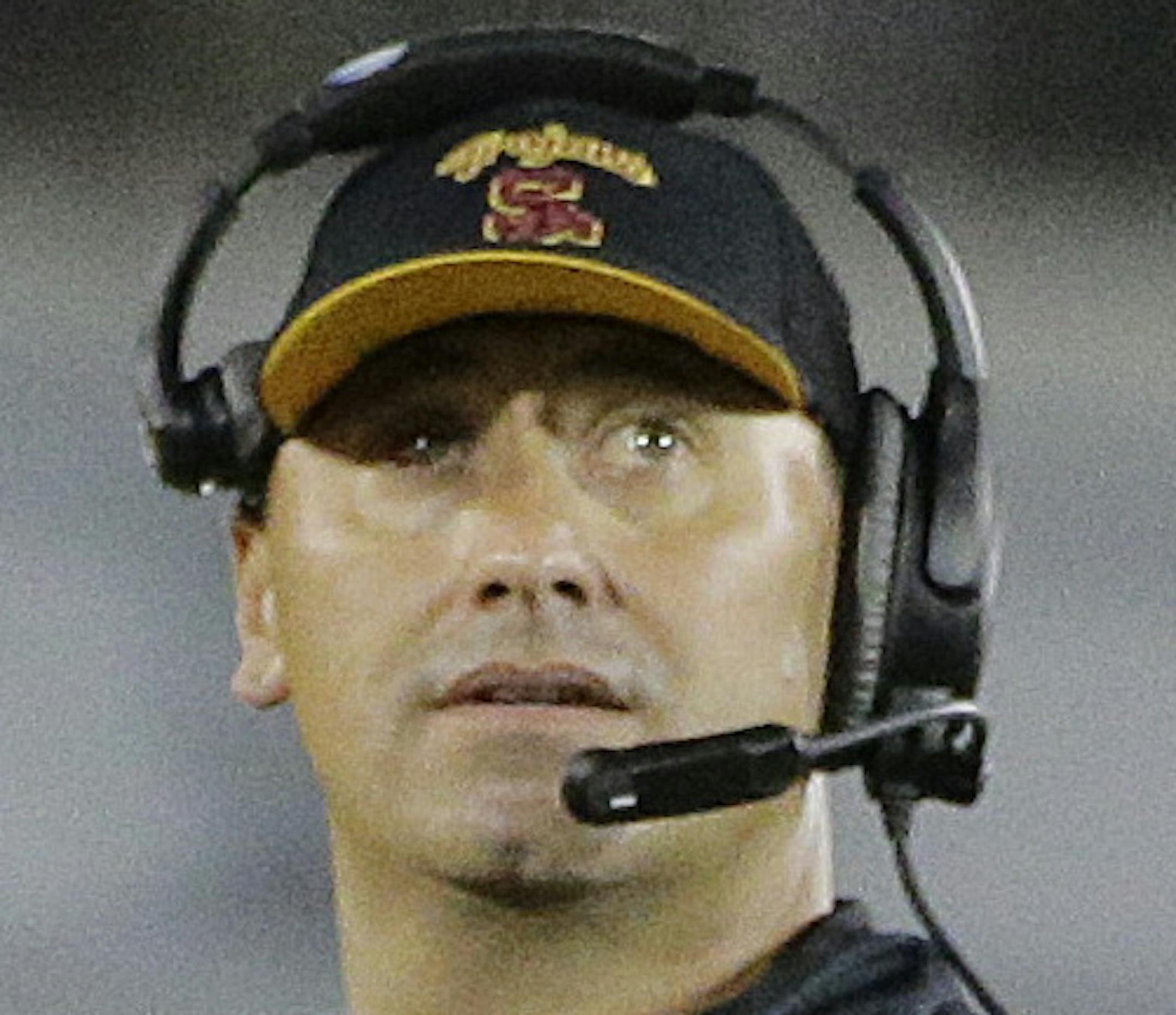 Southern California head coach Steve Sarkisian, center, looks at the scoreboard following a touchdown by Washington during the second half of an NCAA college football game, Thursday, Oct. 8, 2015, in Los Angeles. Washington won 17-12. (AP Photo/Jae C. Hong)