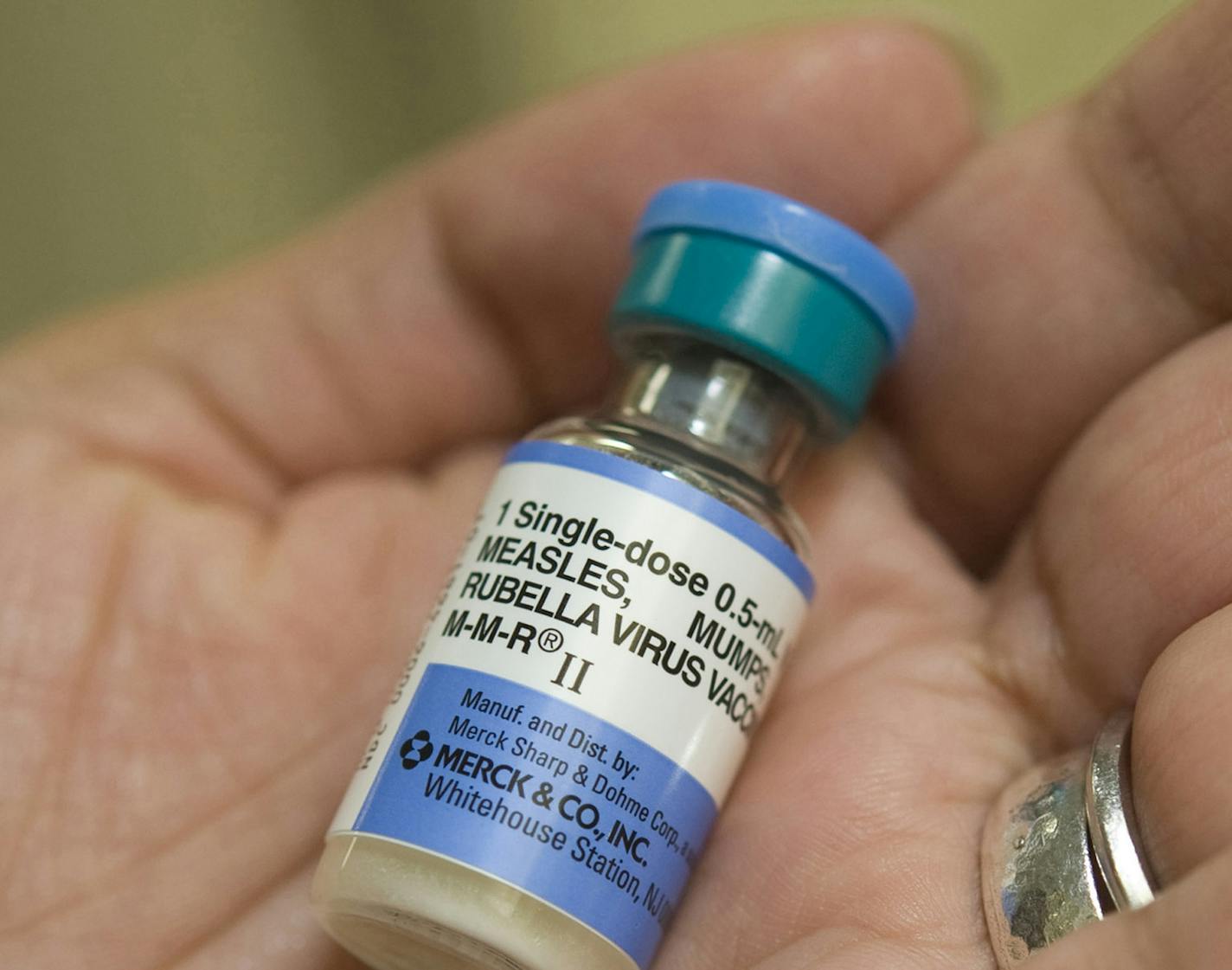 Dr. Shruti K. Gohil, associate medical director for epidemiology and infection prevention at UCI Medical Center, holds a dose of MMR, the vaccine against measles, mumps and rubella. (Ana Venegas/Orange County Register/TNS) ORG XMIT: 1163174 ORG XMIT: MIN1501282305177647