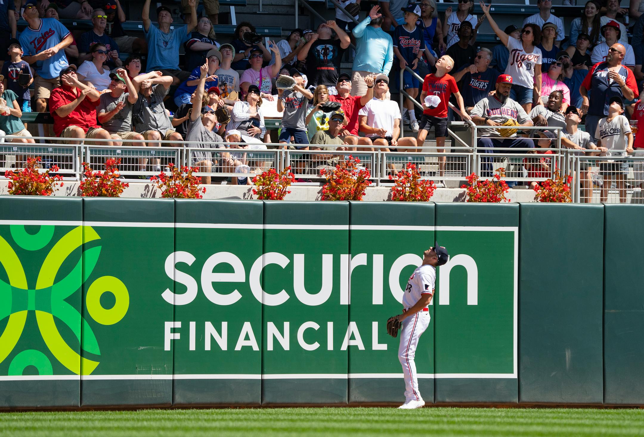 Minnesota Twins left fielder Matt Wallner (38) watches as a ball hit by Detroit Tigers first baseman Spencer Torkelson (20) goes past the wall for a home run in the third inning.