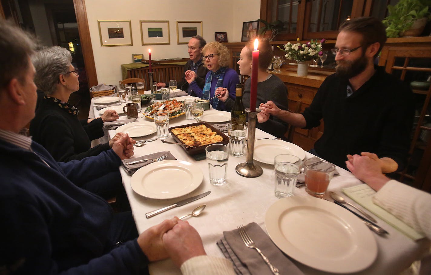 Two families, their children and occasionally friends have been dining together weekly for about 30 years. Here, Ann Luce, back row, second from left, begins the dinner with prayer and seen Friday, Jan. 26, 2018, in Minneapolis, MN.] DAVID JOLES &#xef; david.joles@startribune.com Two families have been dining weekly for 30 years, brought together by young children and continuing on through moments of celebration and sadness. While they now are gearing back on frequency, they have something to sa