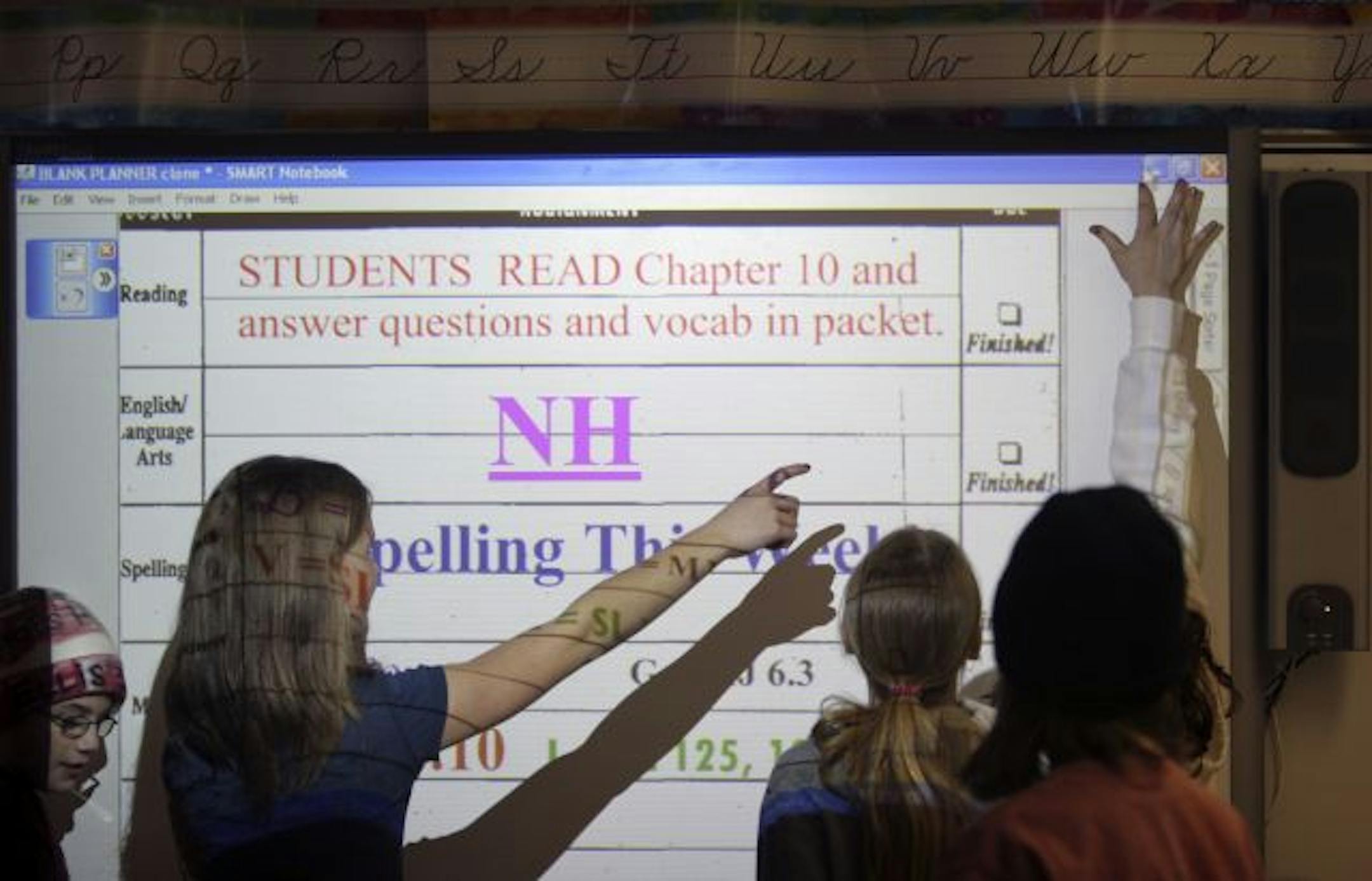 THOMAS WHISENAND*twhisenand@startribune.com 02/21/2007----- Fifth graders at Centerville Elementary School in Centerville, Minn., used an interactive white board during class on Wednesday, February 21. The boards work much like a large touchscreen computer allowing the user to write notes electronically and save lessons for the next day's class. // schools, education, students, teachers //