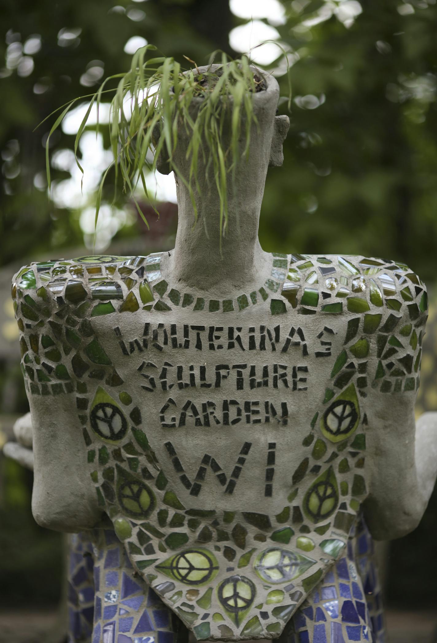 A chair made by the artist in Wouterina de Raad's garden last summer. ] JEFF WHEELER &#xef; jeff.wheeler@startribune.com Artist Wouterina de Raad's garden is a showcase for her concrete mosaic sculptures on her farm in Beldenville, WI. Her gardens were photographed Tuesday, July 29, 2014.