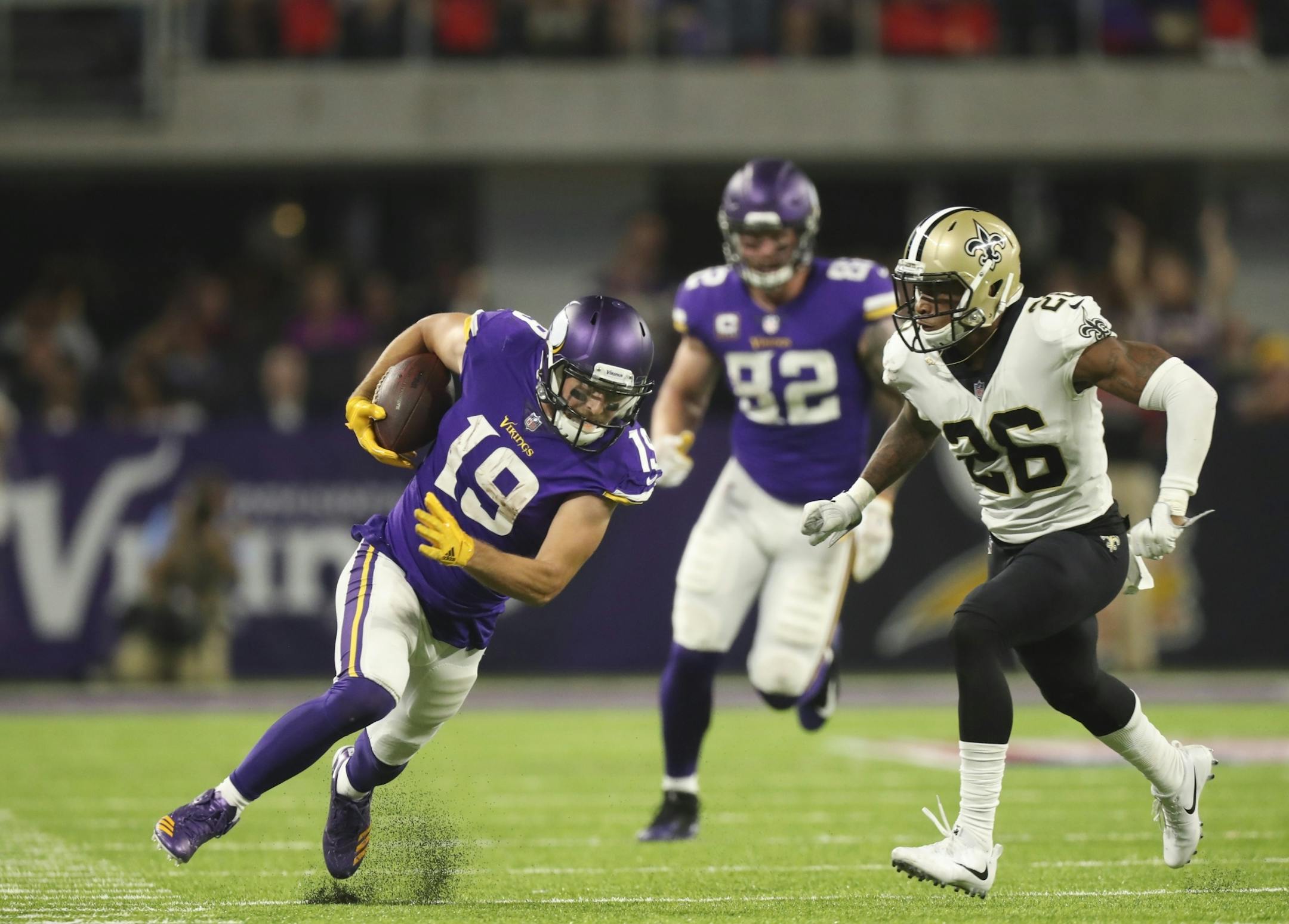 Minnesota Vikings wide receiver Adam Thielen (19) ran after catching a 24 yard pass in the third quarter.