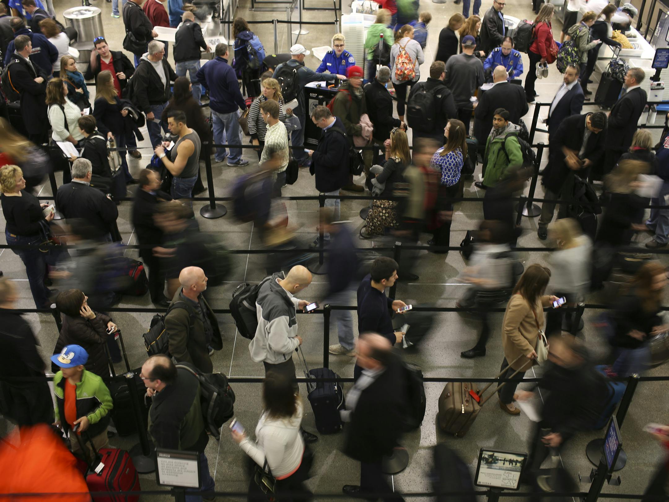 Air travelers waited in line to go through TSA security screening at the airport Wednesday afternoon. ] JEFF WHEELER ‚Ä¢ jeff.wheeler@startribune.com The Metropolitan Airport Commission is telling spring travelers to allow even more time than usual to negotiate parking and security. Lines of travelers waited to go through security in the Lindbergh Terminal at Minneapolis-St. Paul International Airport Wednesday afternoon, March 26, 2014. ORG XMIT: MIN1403261806381206