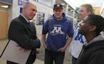 (left to right) Minnetonka High School Prinicipal Dave Adney talked with students Duncan Johnson, Derrick DeBoer and Caleb Sharp between classes in th