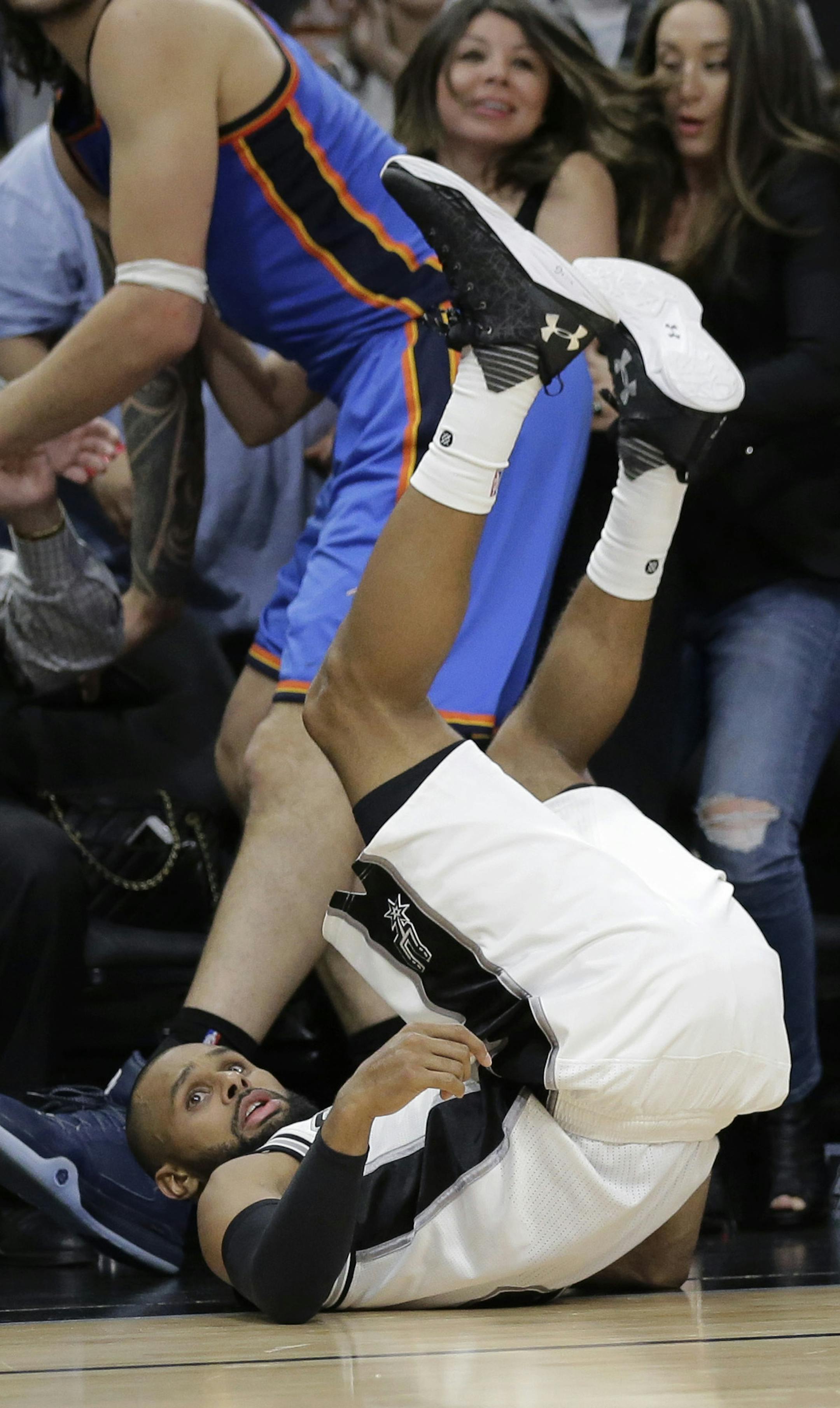 San Antonio Spurs guard Patty Mills (8) falls to the floor as he watches his last second attempt miss during the second half in Game 2 of a second-round NBA basketball playoff series against the Oklahoma City Thunder, Monday, May 2, 2016, in San Antonio. Oklahoma City won 98-97. (AP Photo/Eric Gay)