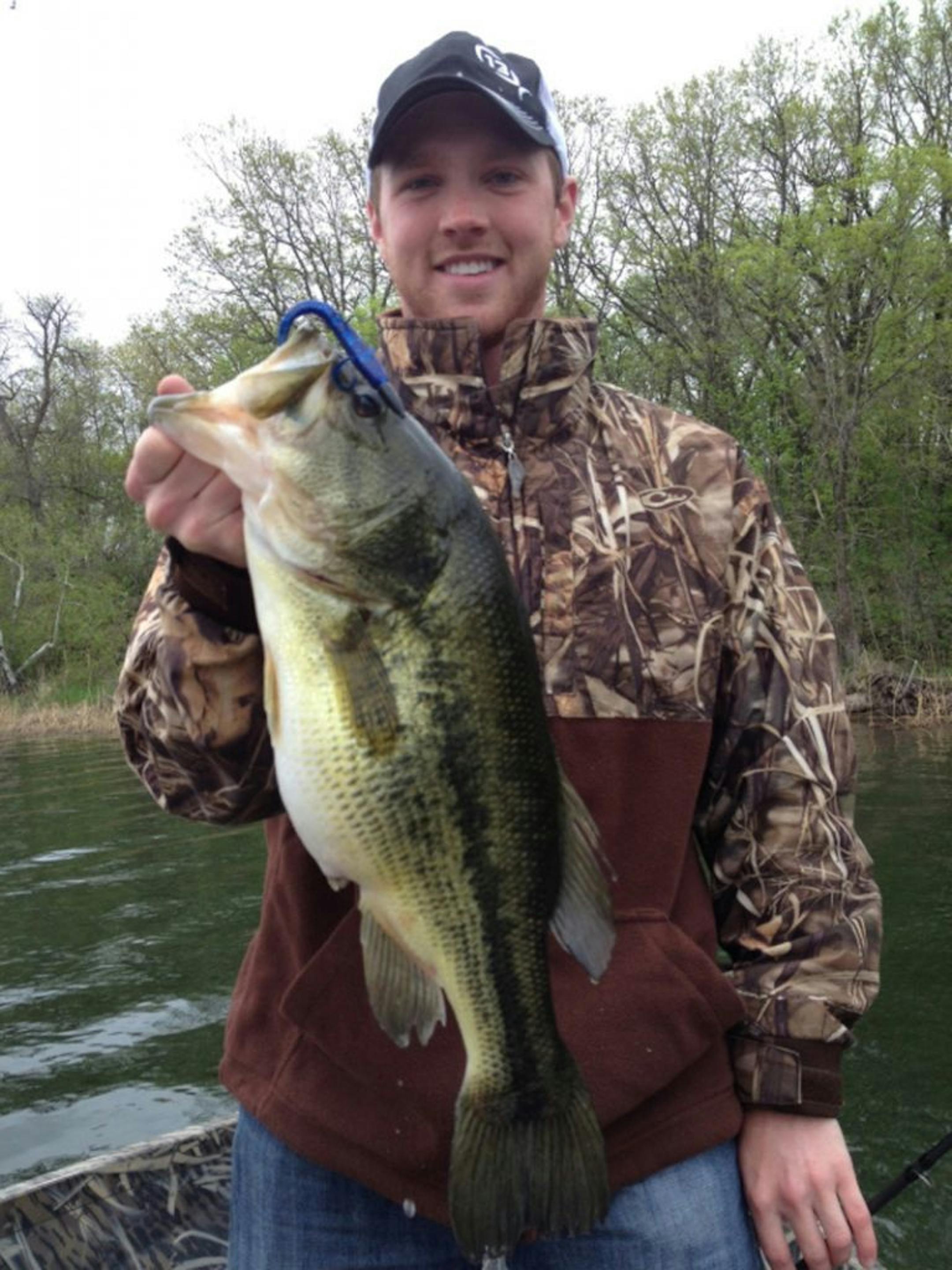 LUNKER LARGEMOUTH Nick Schneider of Maplewood caught this monster 5.5-pound largemouth bass recently in an Alexandria-area lake. He caught it using a Texas-rigged plastic lizard.
