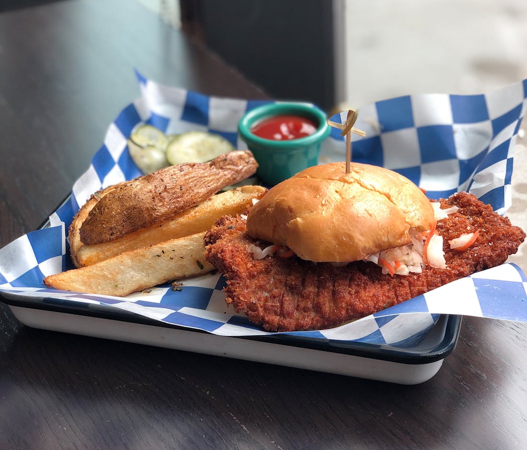 The pork schnitzel sandwich at Farmers Kitchen + Bar is a commitment. 
