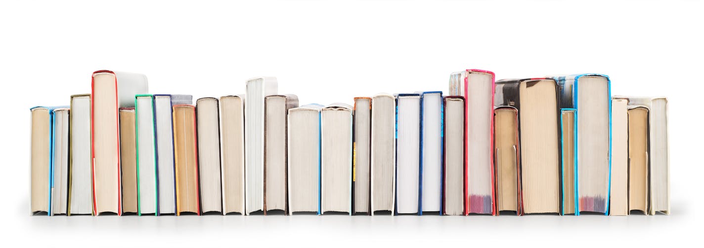 Stack of books isolated on a white background BY THE BOOK SOLUTION FOR SOUTHDALE MALL