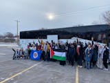 Rally participants unfurled the Minnesota and Palestinian flags Friday in Brooklyn Park before boarding the bus for Washington, D.C.