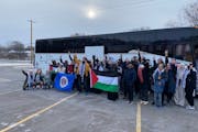 Rally participants unfurled the Minnesota and Palestinian flags Friday in Brooklyn Park before boarding the bus for Washington, D.C.