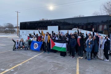 Rally participants unfurled the Minnesota and Palestinian flags Friday in Brooklyn Park before boarding the bus for Washington, D.C.