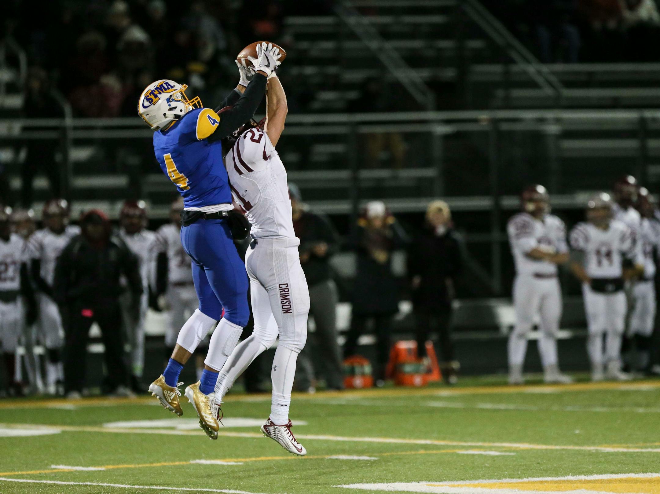 St. Michael-Albertville's Xavier Thurman (4) caught an interception in a jump against Maple Grove's Joe Raymon (21) in the second half. ] RENEE JONES SCHNEIDER • renee.jones@startribune.com Class 6A quarterfinals between St. Michael-Albertville and Maple Grove on Thursday, November 9, 2017, in Brooklyn Park, Minn.