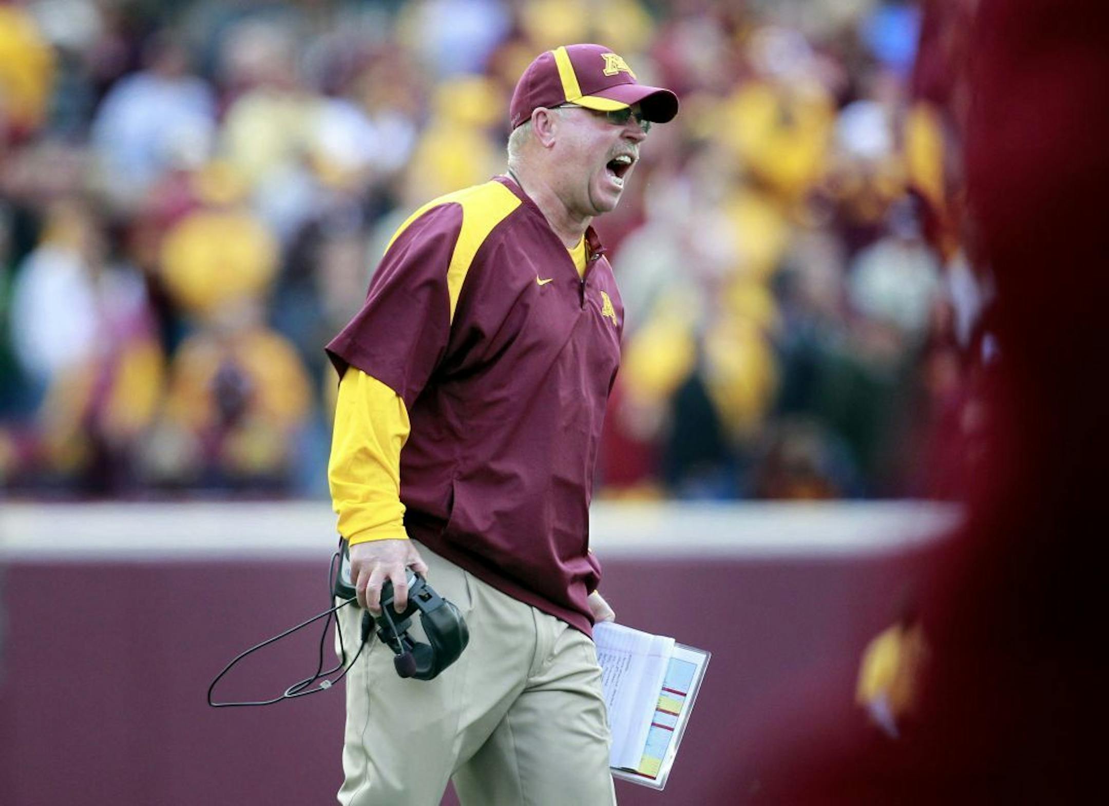 Minnesota head football coach Jerry Kill reacted after Chris Hawthorne missed and extra point attempt in the fourth quarter. Minnesota beat Miami by a final score of 29 – 23. The win was Kill's first as coach of the Gophers.