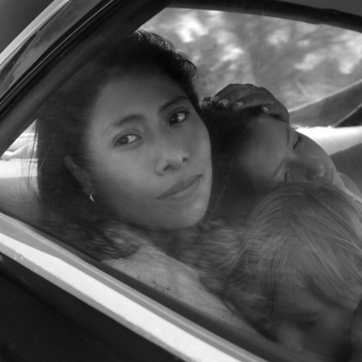 This image released by Netflix shows Yalitza Aparicio in a scene from the film "Roma," by filmmaker Alfonso Cuaron. Aparicio portrays Cleo, a domestic worker who works for a woman whose husband abandons her and their four children. (Alfonso Cuar&#xf3;n/Netflix via AP)