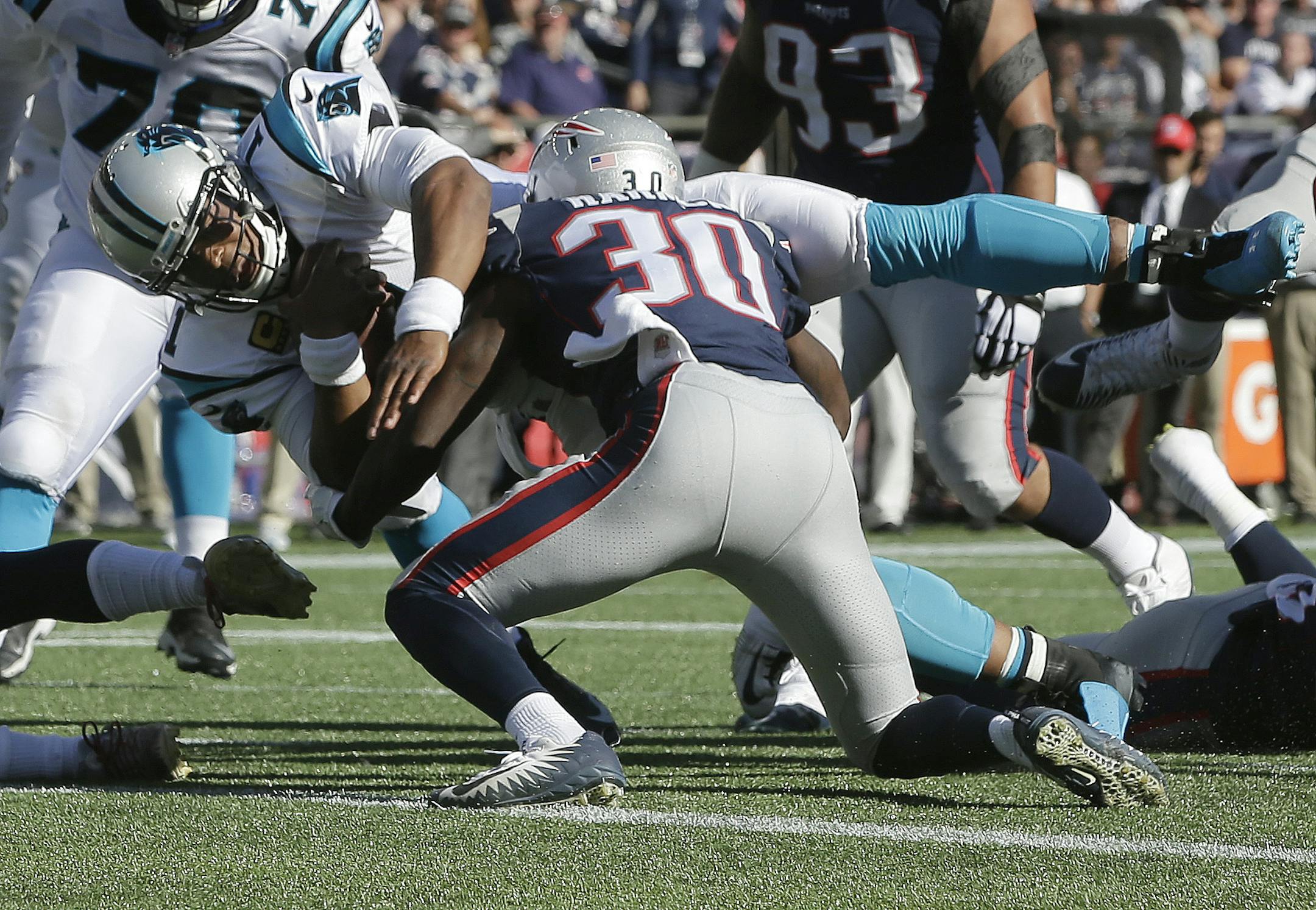 Carolina Panthers quarterback Cam Newton dives for a touchdown past New England Patriots safety Duron Harmon (30) during the second half of an NFL football game, Sunday, Oct. 1, 2017, in Foxborough, Mass. (AP Photo/Steven Senne)