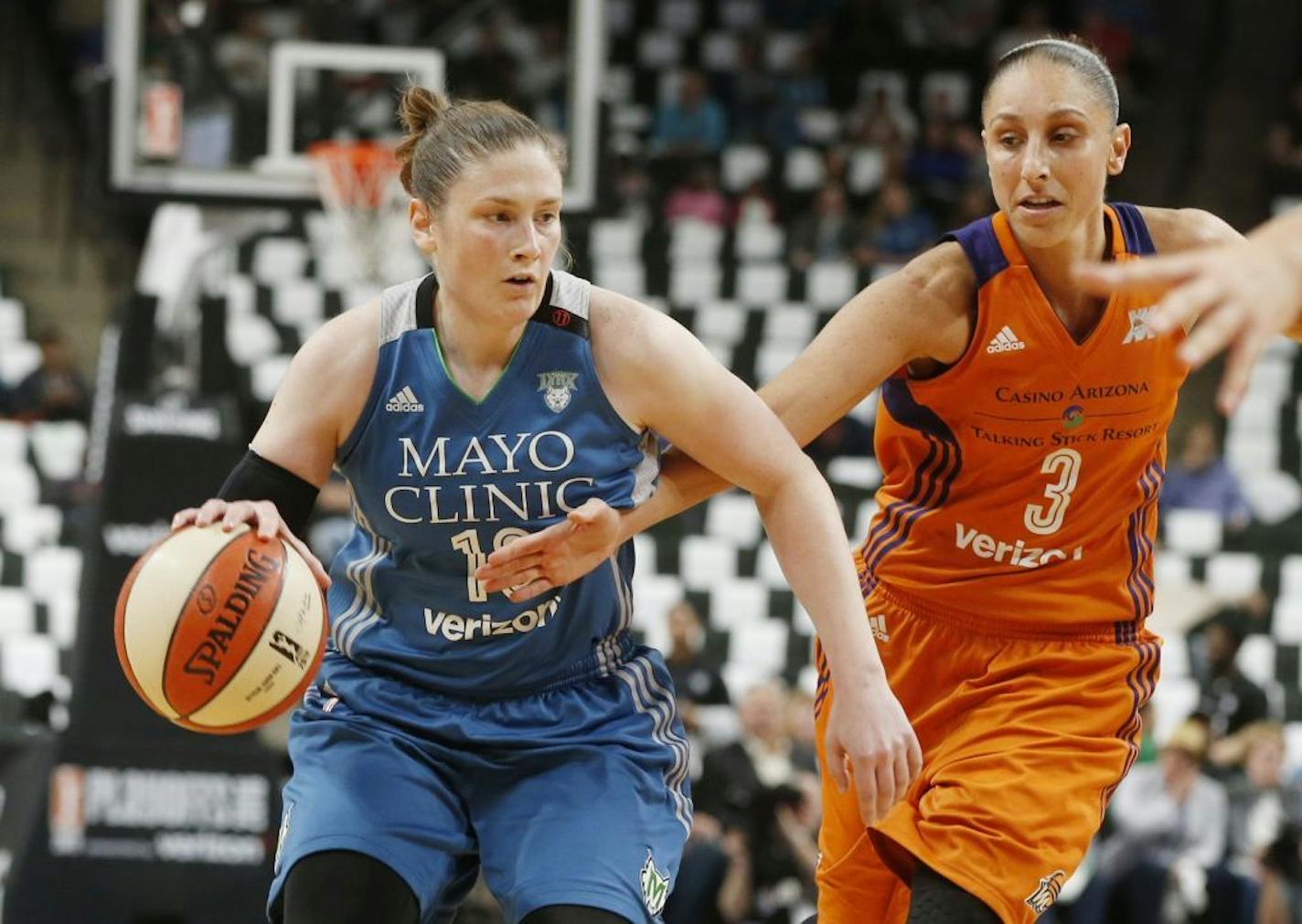 Phoenix Mercury's' Diana Taurasi, right, tries to reach the ball as Minnesota Lynx's Lindsay Whalen drives in the first quarter of a WNBA playoff semi-finals basketball game Wednesday, Sept. 28, 2016, in St. Paul, Minn.