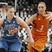 Phoenix Mercury's' Diana Taurasi, right, tries to reach the ball as Minnesota Lynx's Lindsay Whalen drives in the first quarter of a WNBA playoff semi