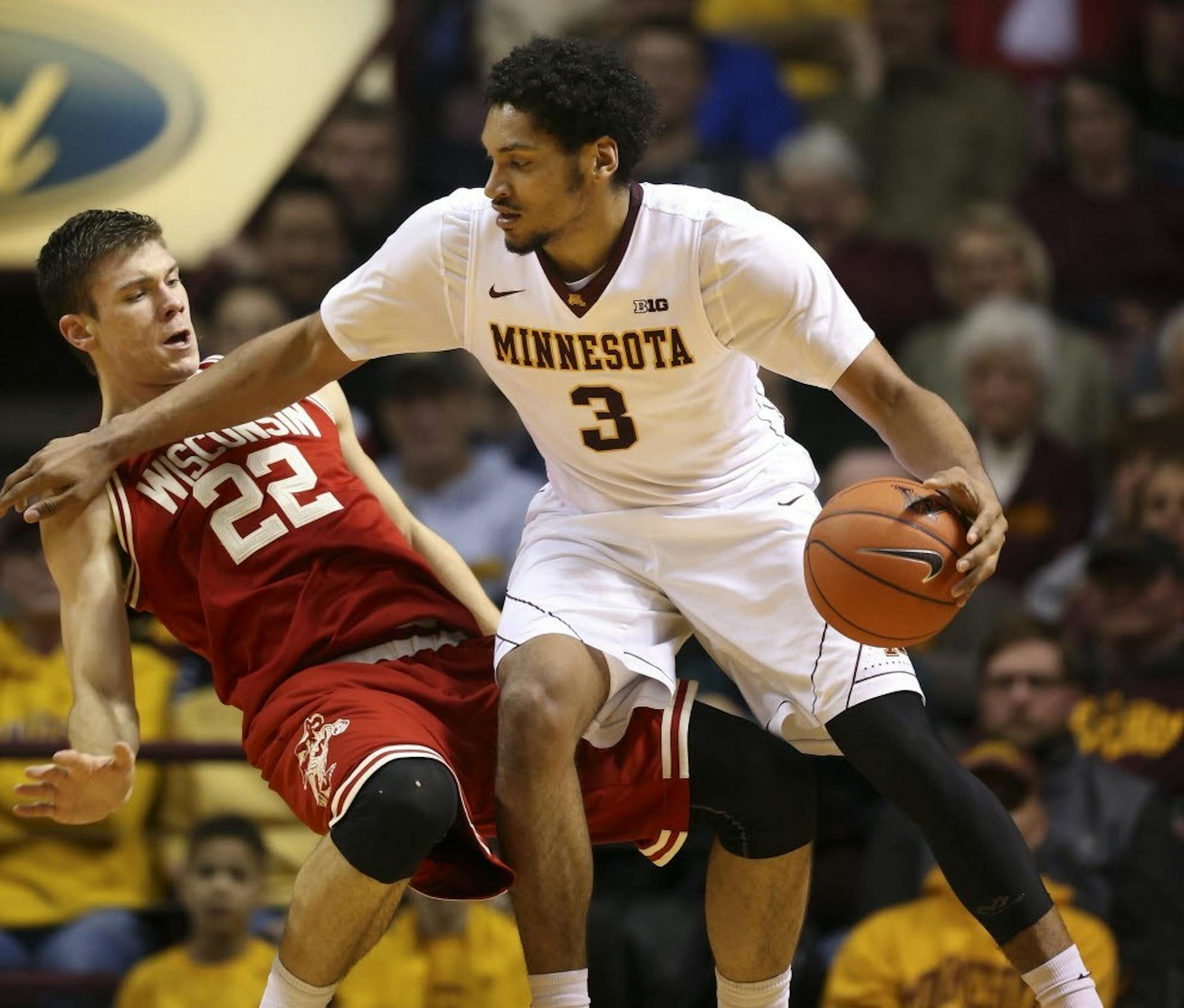Gophers forward Jordan Murphy was fouled by Badgers forward Ethan Happ during a game last season.