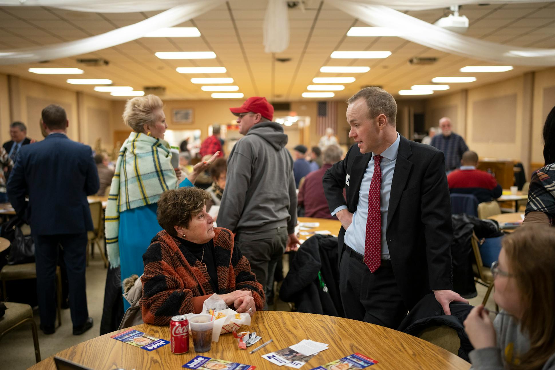 Attorney general candidates Jim Schultz, foreground, and Lynne Torgerson, standing rear, chatted with attendees before a GOP debate in Owatonna.