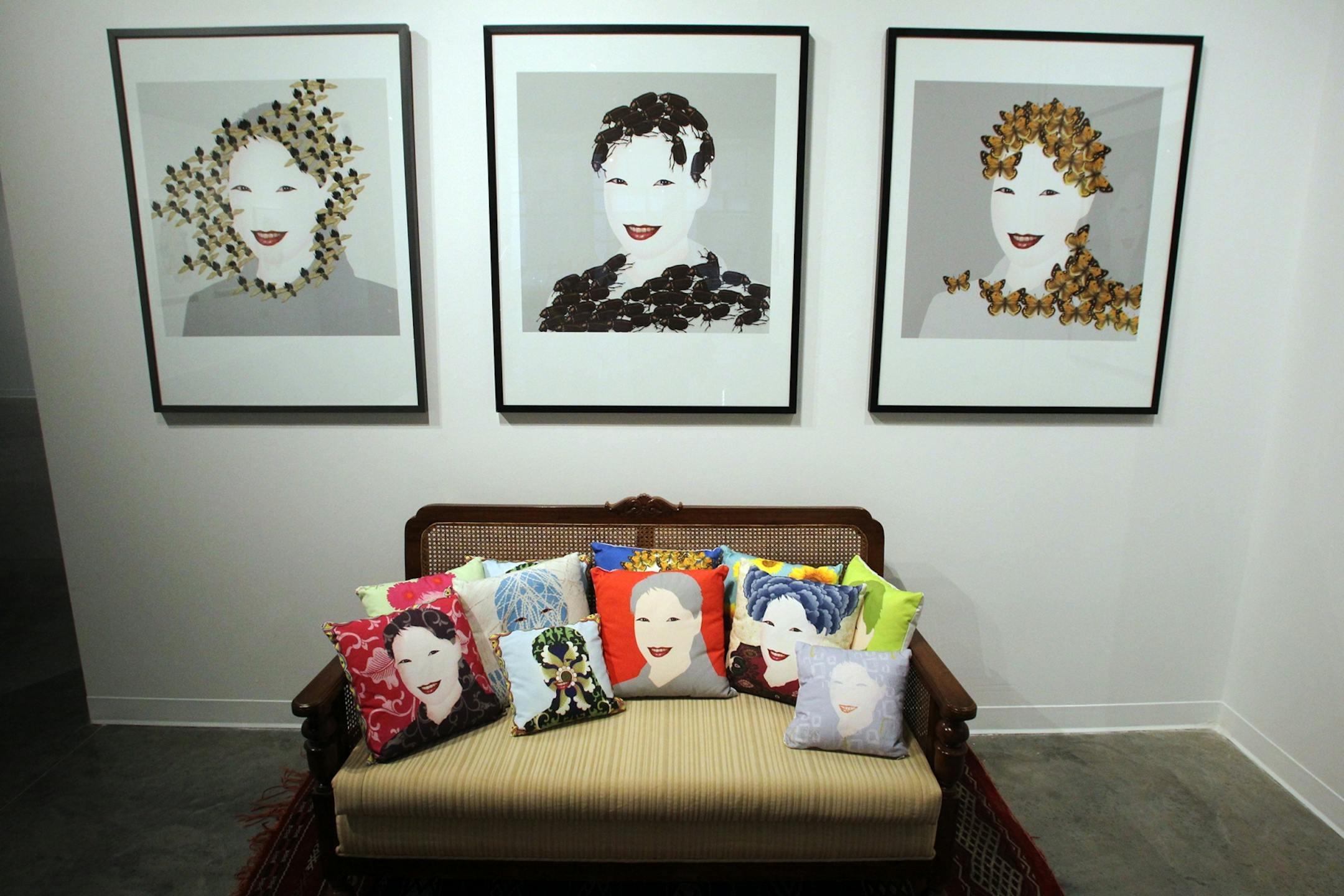 Tom Garrett adds insects and ornaments to female lips and eyes in his "Pillows" and "Bee Woman," "Bug Woman" and "Butterfly Woman."
