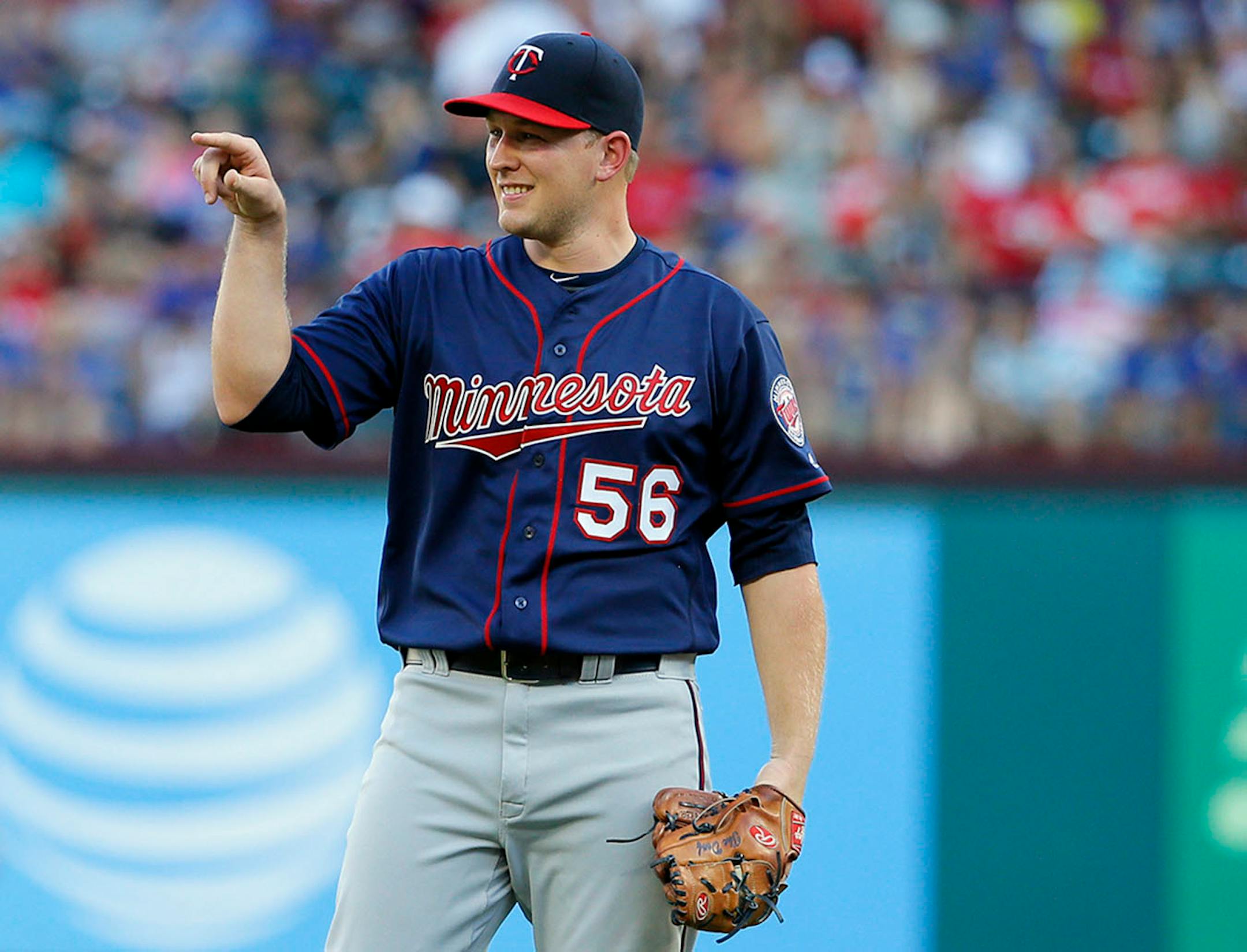 Minnesota Twins' Tyler Duffey points to third before walking onto the mound in the first inning of a baseball game against the Texas Rangers on Thursday, July 7, 2016, in Arlington, Texas.
