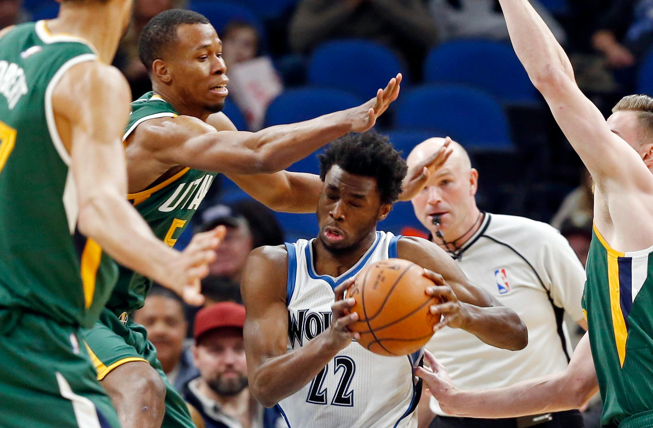 Minnesota Timberwolves' Andrew Wiggins, center, drives past Utah Jazz's Rodney Hood, second from left, during the first quarter of an NBA basketball game Saturday, Jan. 7, 2017, in Minneapolis. (AP Photo/Jim Mone)