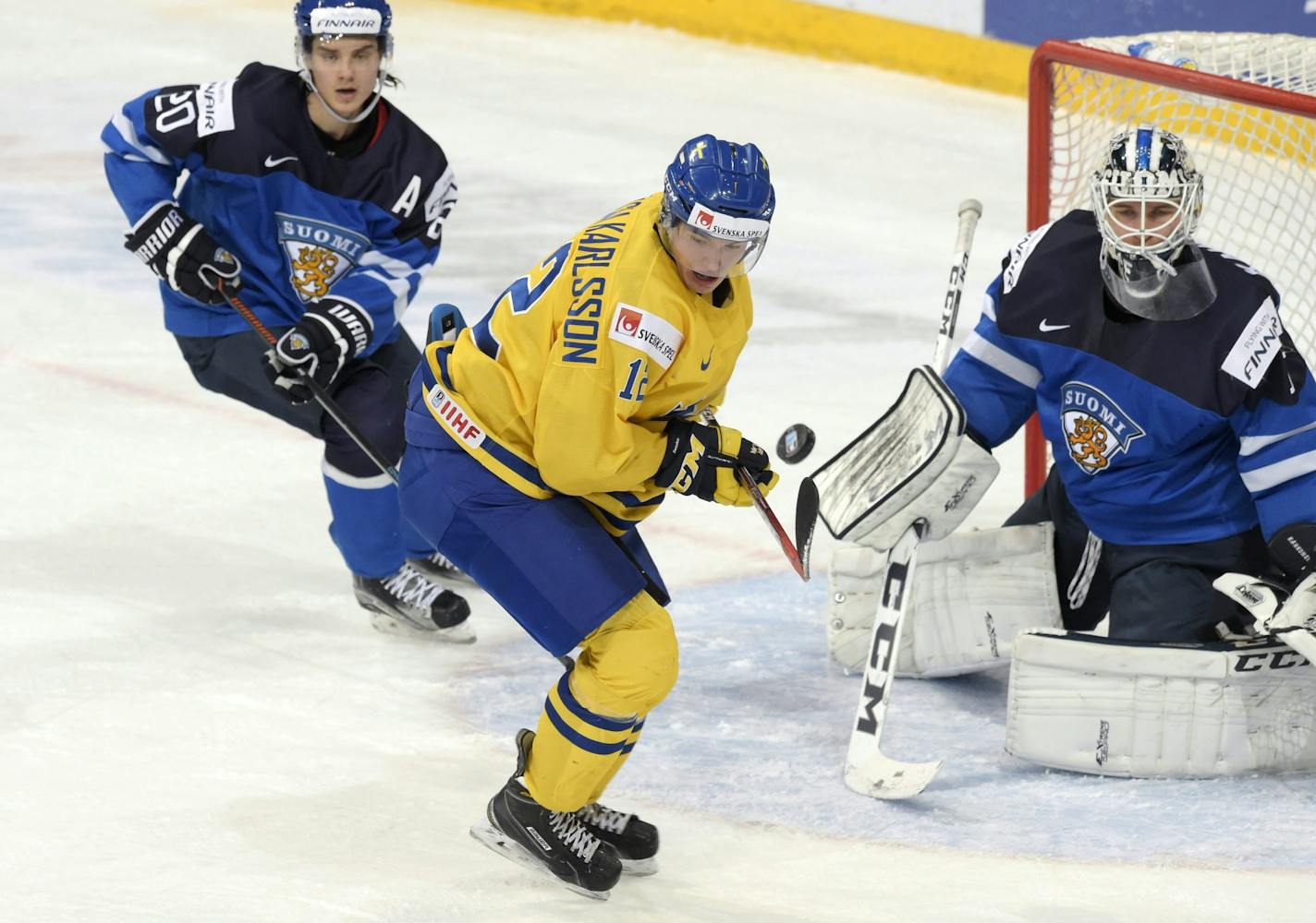 Finnish goalie Kaapo Kahkonen, a Wild draft pick, kept on eye on the puck and Sweden&#x2019;s Jakob Forsbacka Karlsson during Monday&#x2019;s world juniors semifinal.