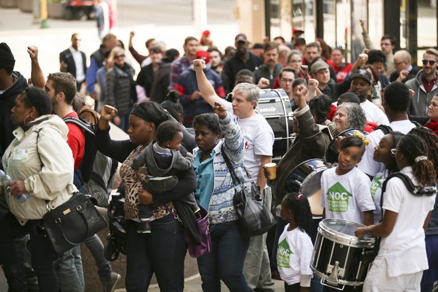 After an invigorating performance by a drill & dance team, demonstrators entered City Hall to march silently through the halls Thursday afternoon.