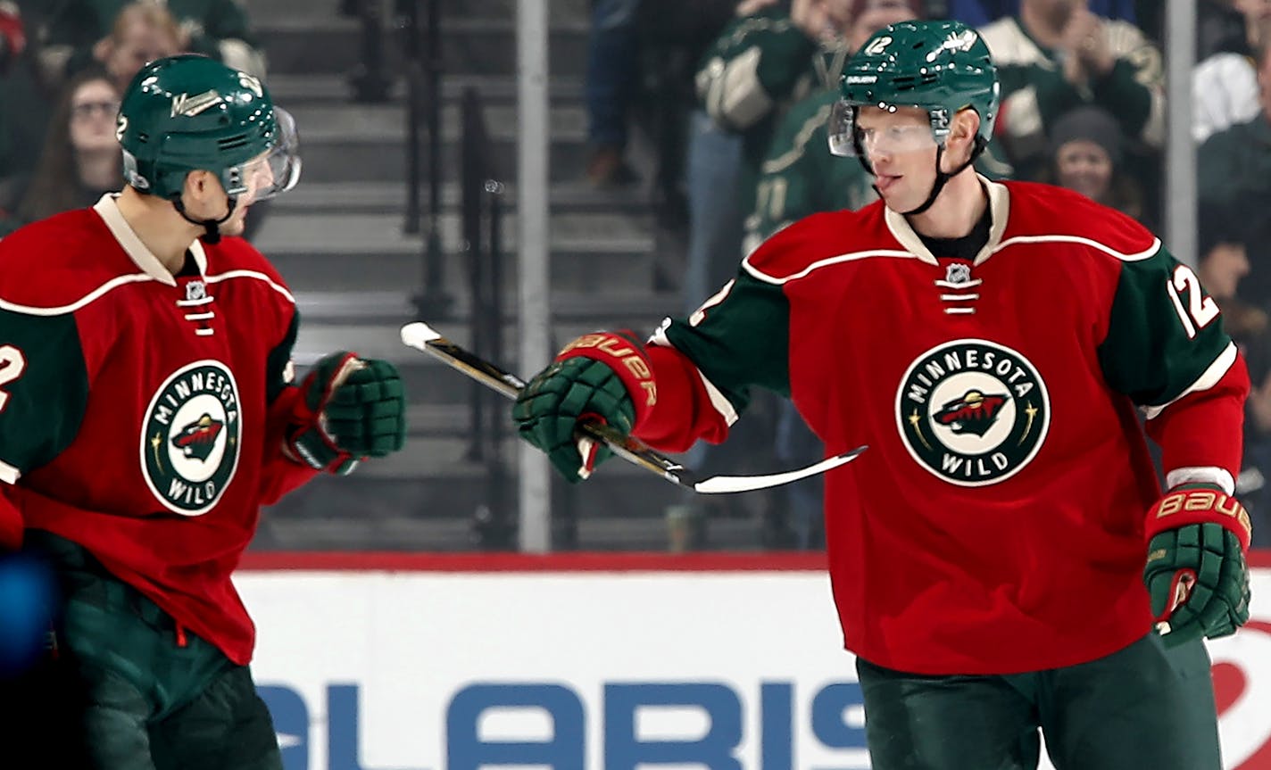 Nino Niederreiter (22) and Eric Staal (12) celebrated a Staal goal in the first period.