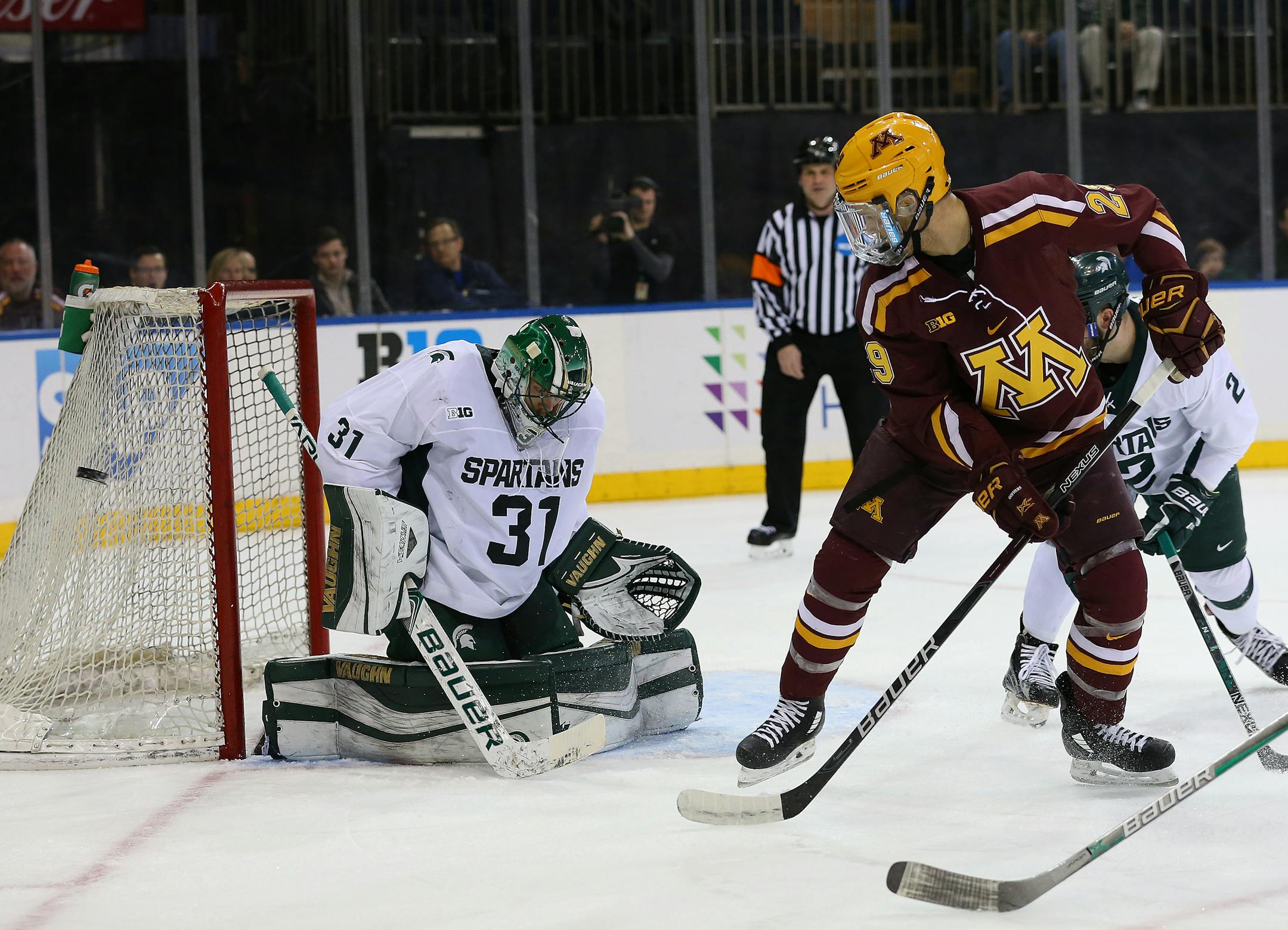 Gophers defenseman Tyler Nanne (29) attempts a shot that sails to the right of Michigan State Spartans goalie John Lethemon