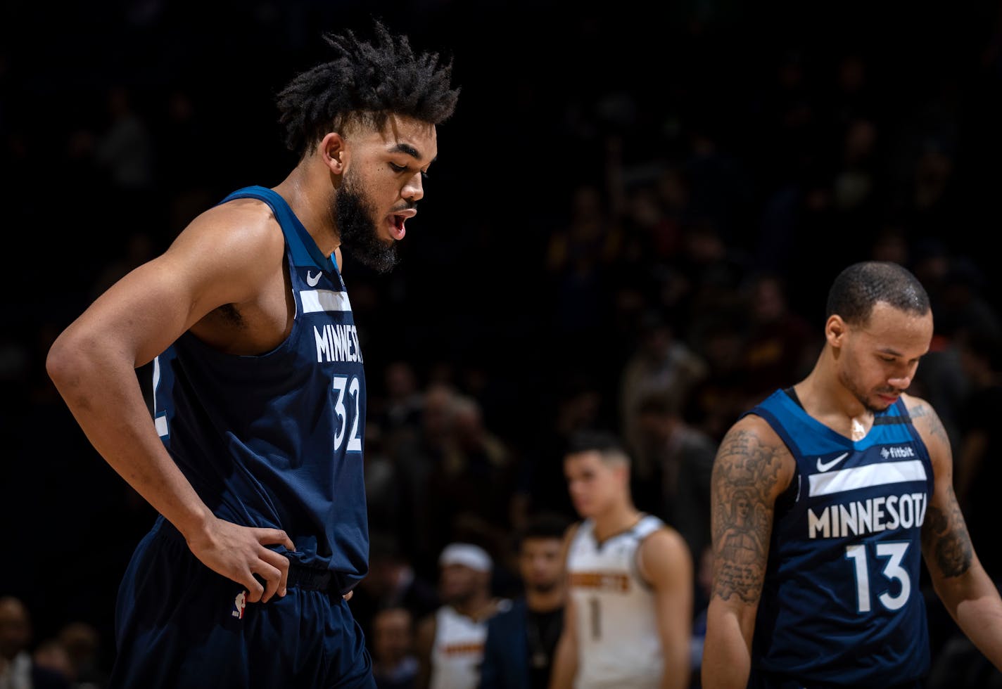 Timberwolves center Karl-Anthony Towns (32) and point guard Shabazz Napier walked off the court after a 107-100 loss to the Nuggets at Target Center on Monday night.