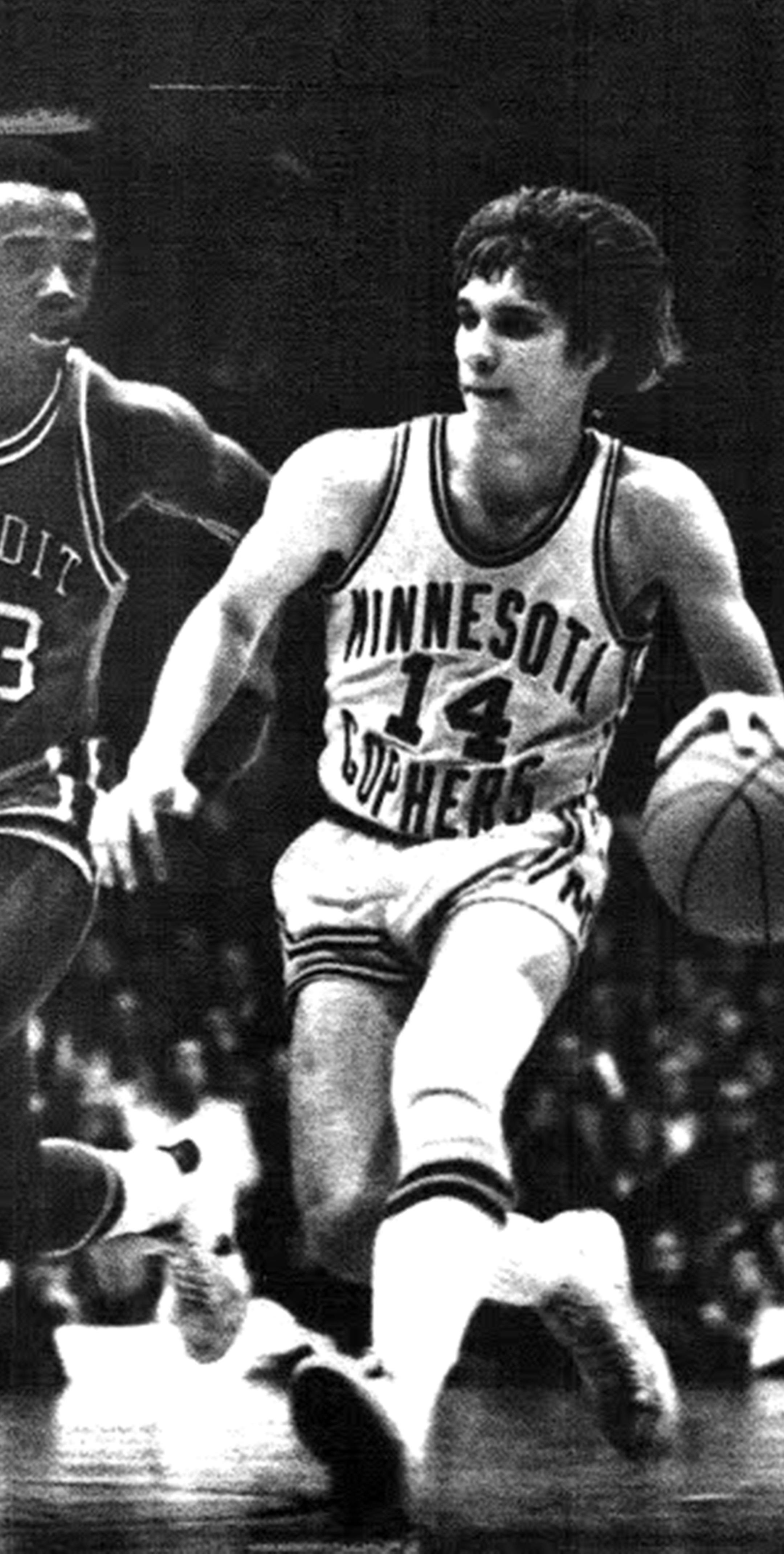 January 9, 1974 Phil Saunders (no. 14) Drives Past Detroit's Riley DotsonMinnesota guard drove into basket for first - half score United Press International [ Flip Saunders