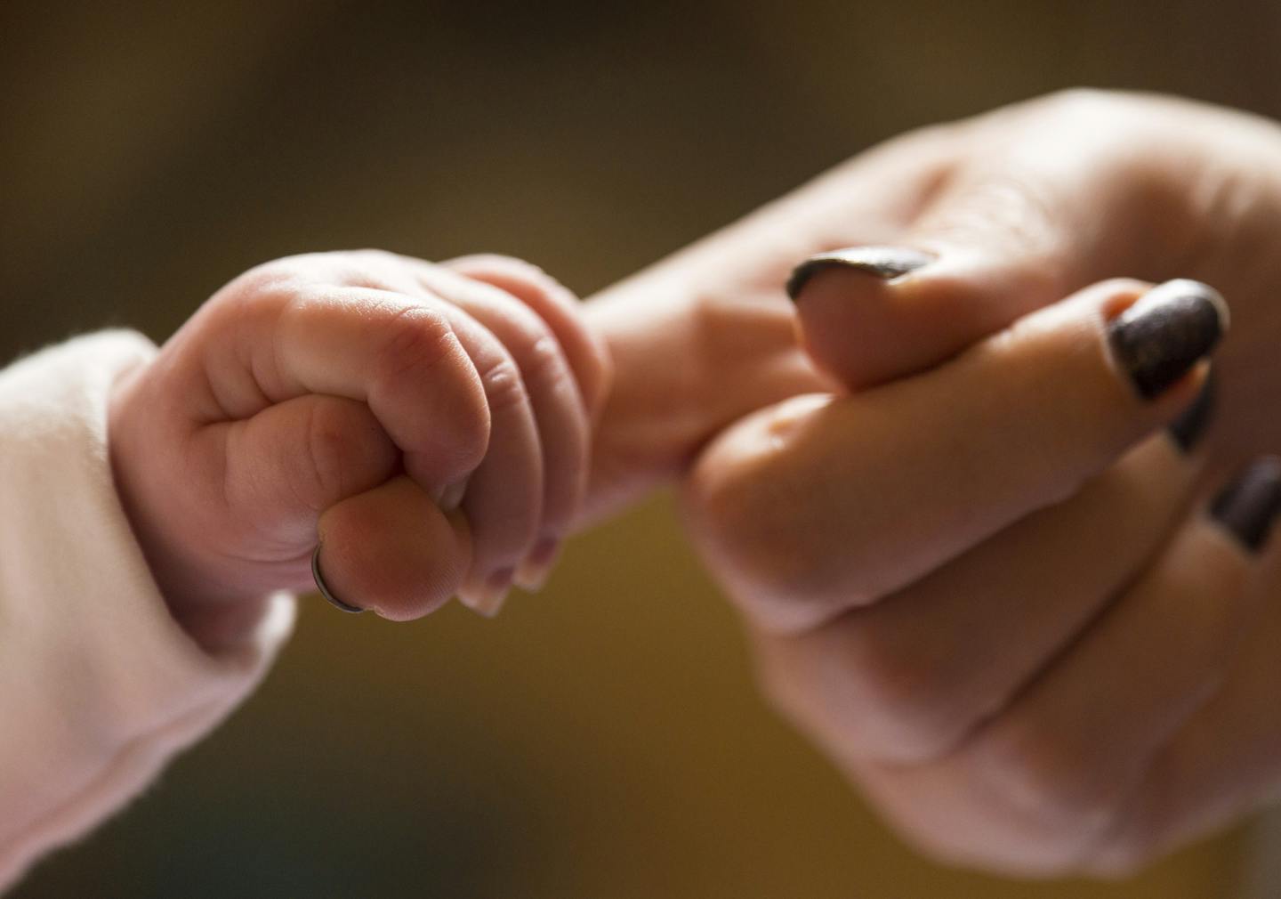 Declining fertility rates. File photo dated 23/01/16 of a baby holding the finger of its mother. Declining fertility rates around the world are leading to a "baby bust" in many countries including the UK, health experts have warned. Issue date: Friday November 9, 2018. Globally fertility rates, which represent the average number of children a woman delivers over her lifetime, have declined since 1950 and in 91 nations, rates are now not high enough to maintain current population levels. See PA s