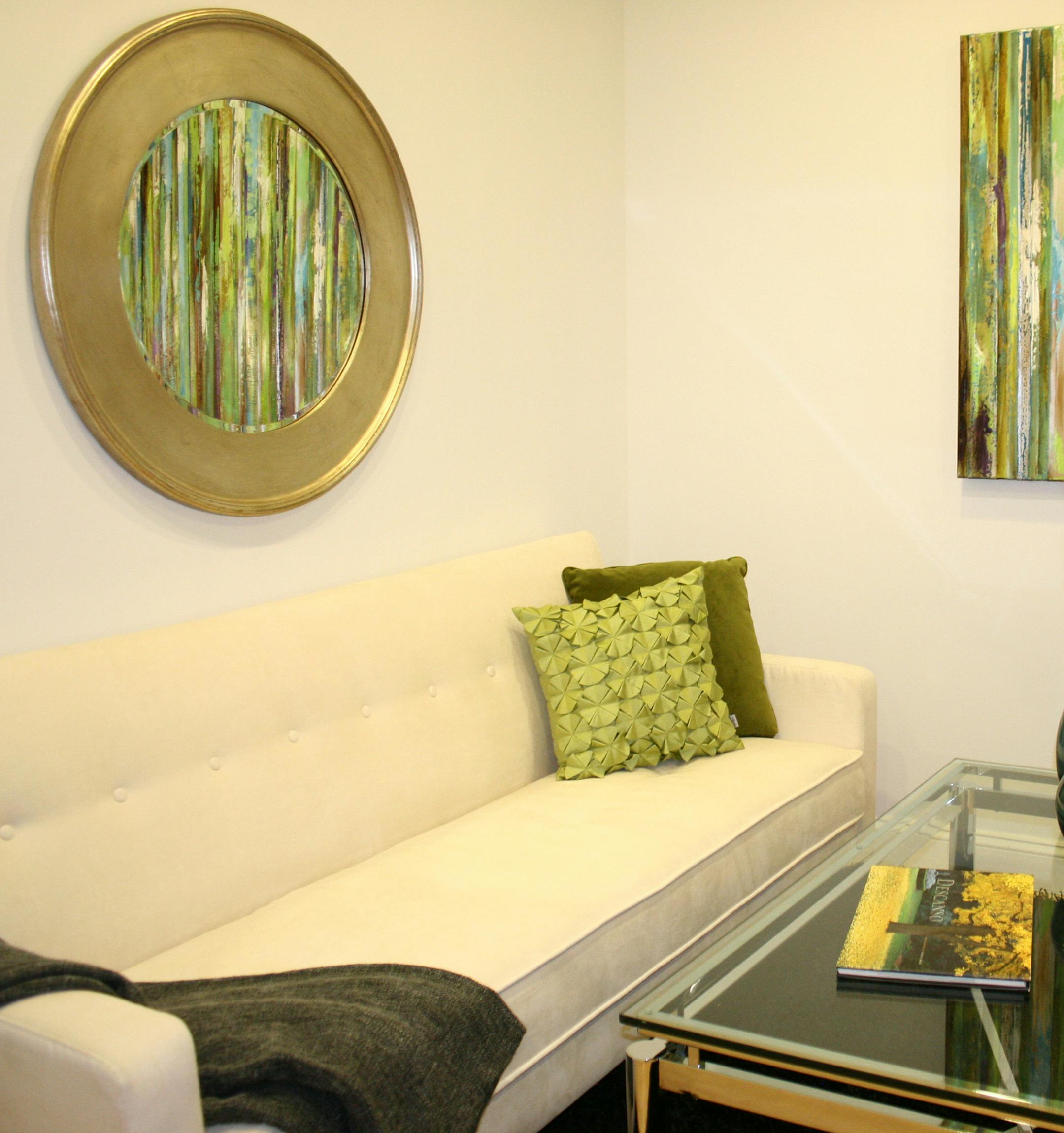 Multiple spring elements such as a yellow painted walls, pops of green and use of greenery helps to convey a fresh look.