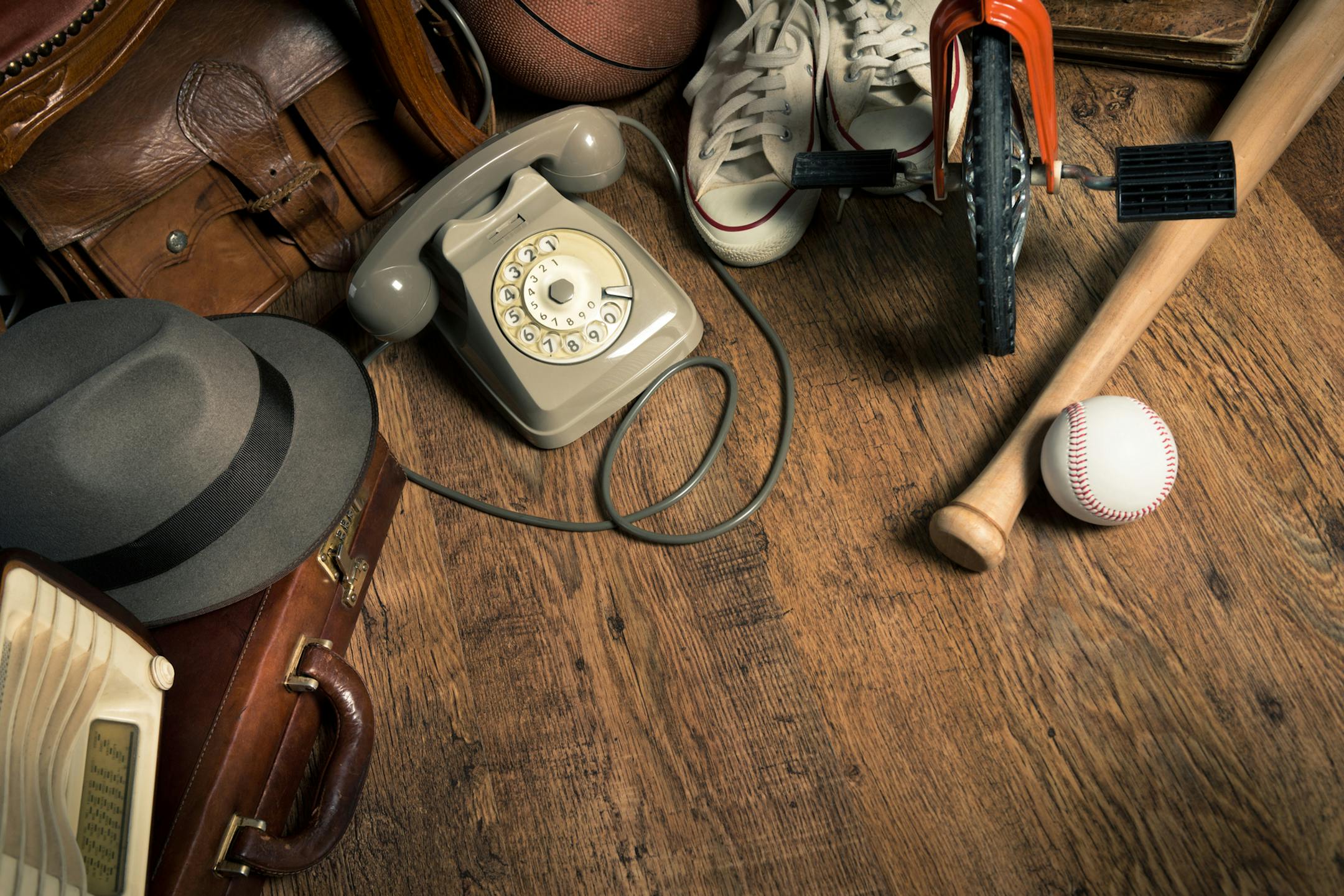 Group of assorted vintage items on hardwood floor at flea market. istock photo
