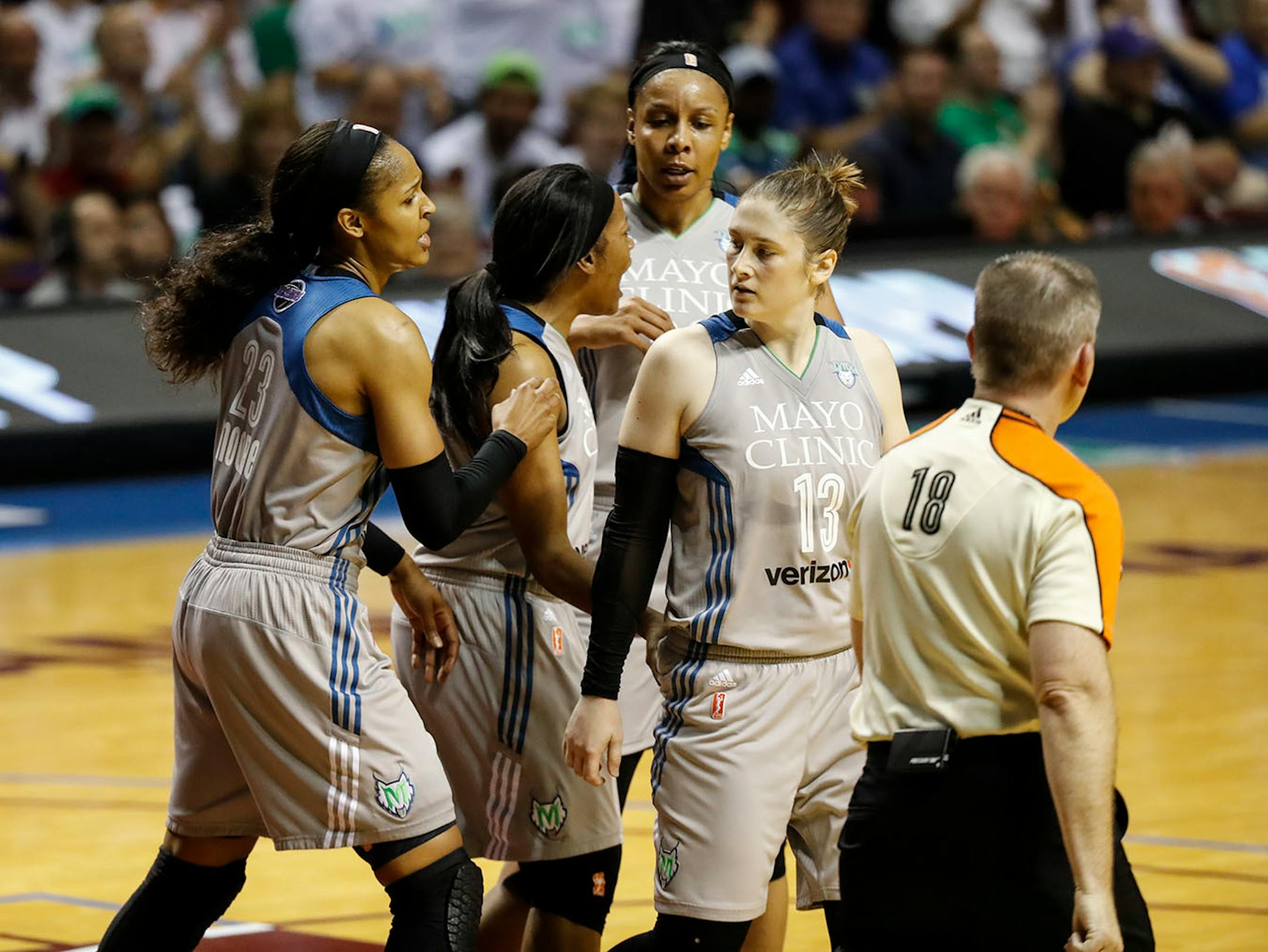 Minnesota Lynx guard Lindsay Whalen (13) glared at a Sparks player that tried to block her in a play that ended in her making two point shot and an extra point from a foul during the first half.