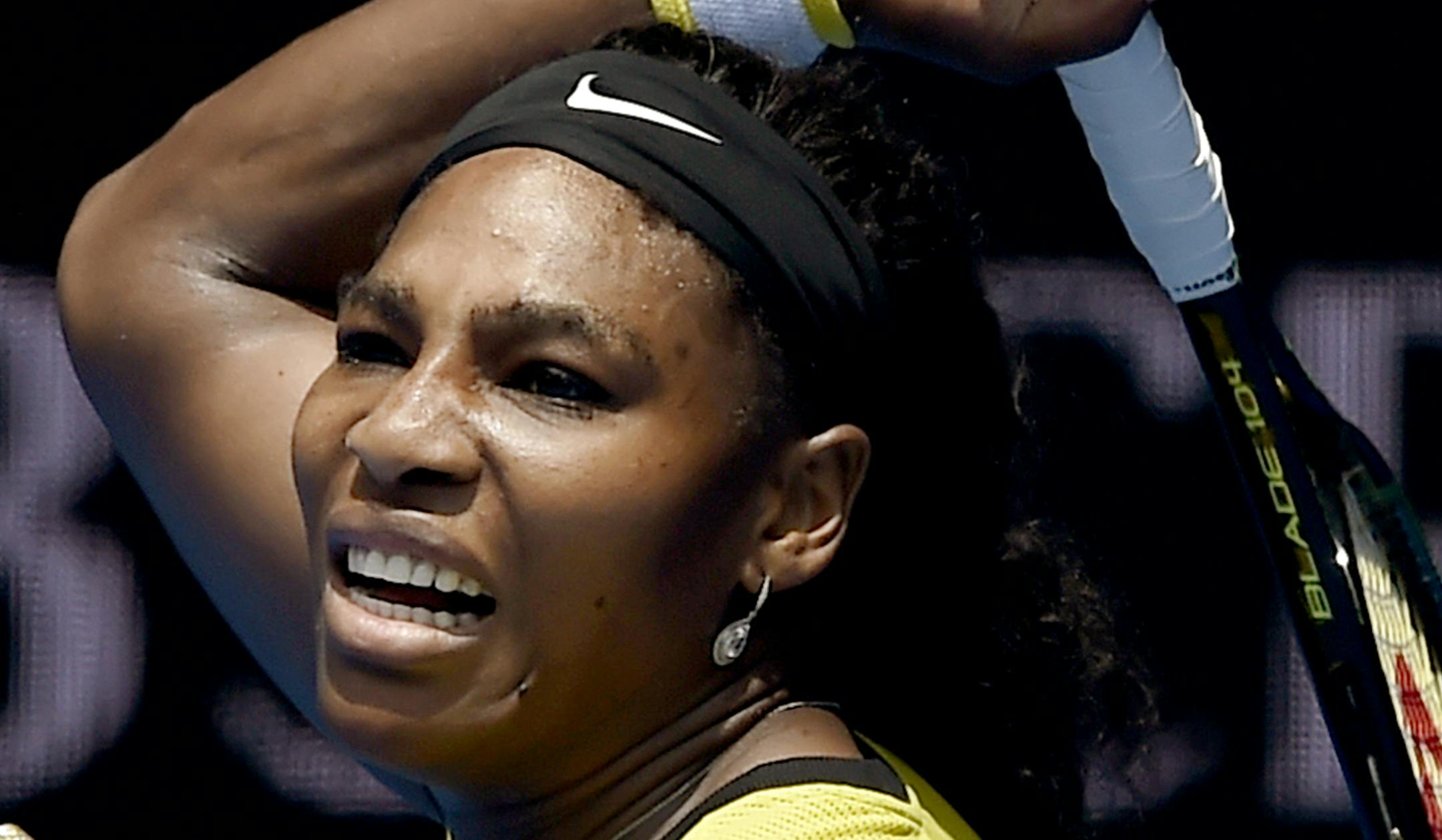 Serena Williams of the United States plays a forehand return to Maria Sharapova of Russia during their quarterfinal match at the Australian Open tennis championships in Melbourne, Australia, Tuesday, Jan. 26, 2016.(AP Photo/Andrew Brownbill)
