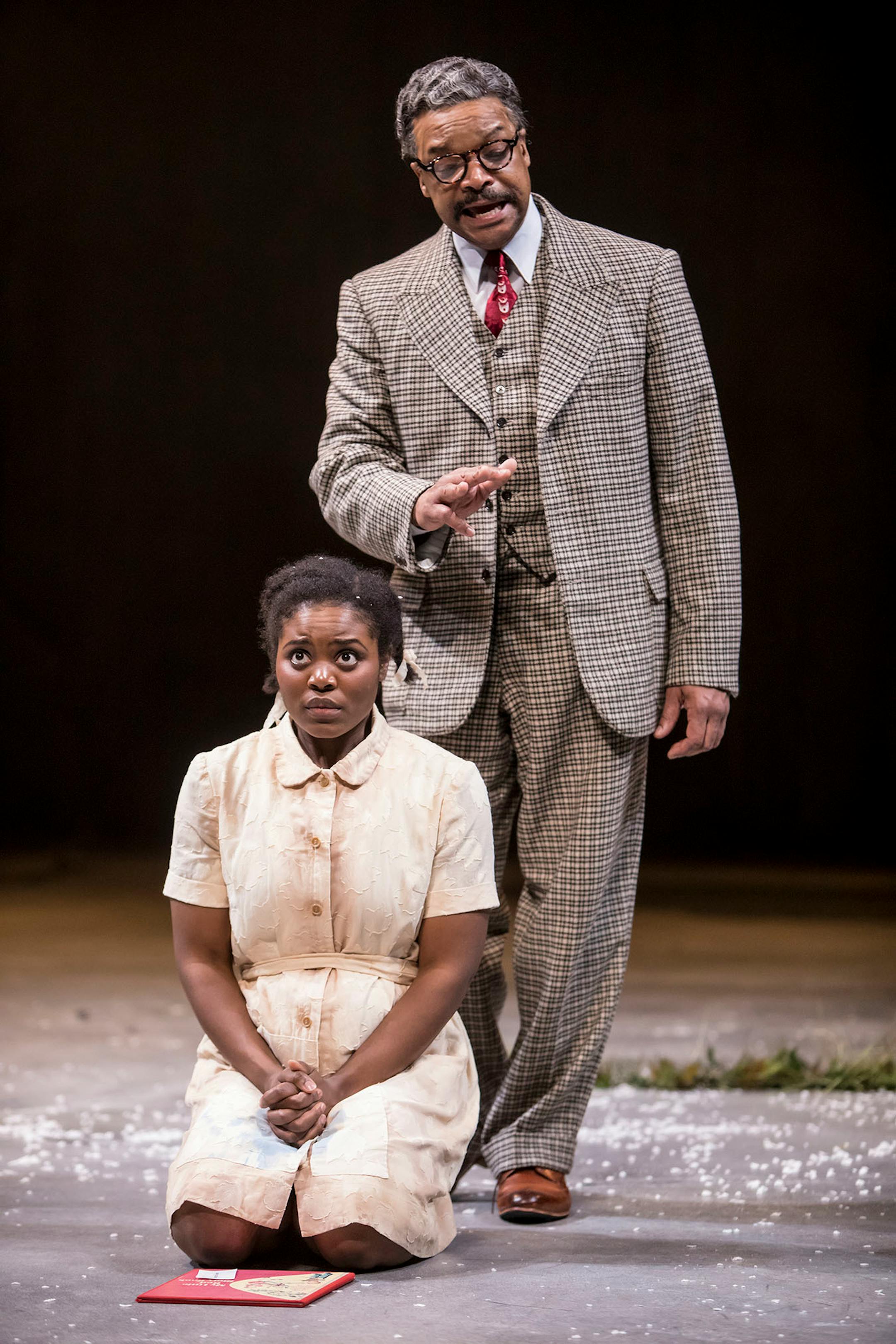 Brittany Bellizeare (Pecola) and Shawn Hamilton (Soaphead Church) in the Guthrie Theater's production of Toni Morrison's The Bluest Eye, adapted by Lydia R. Diamond and directed by Lileana Blain-Cruz.