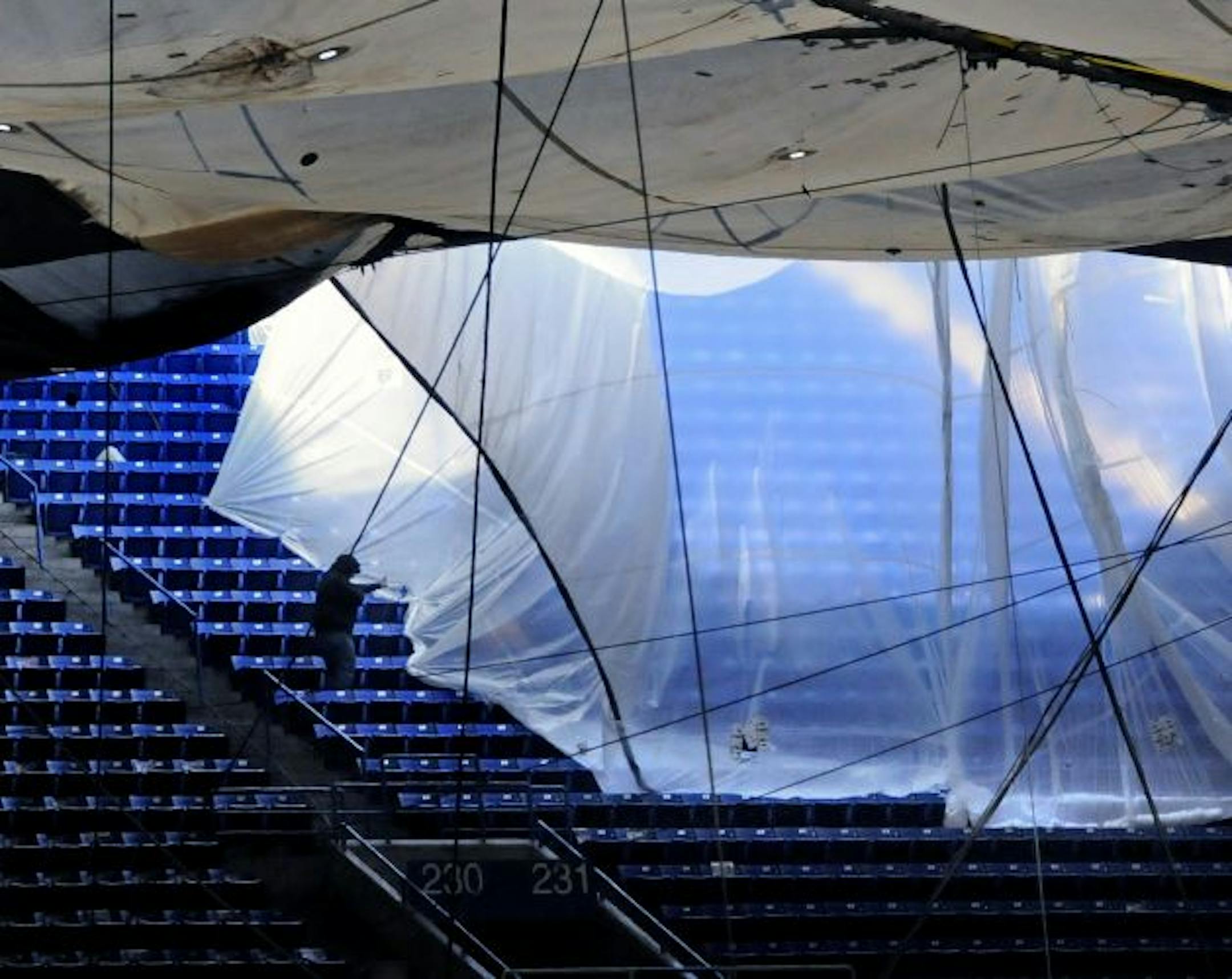 Workers have been waterproofing the upper deck at the Metrodome with plastic sheets to prevent leakage onto the main concourse.