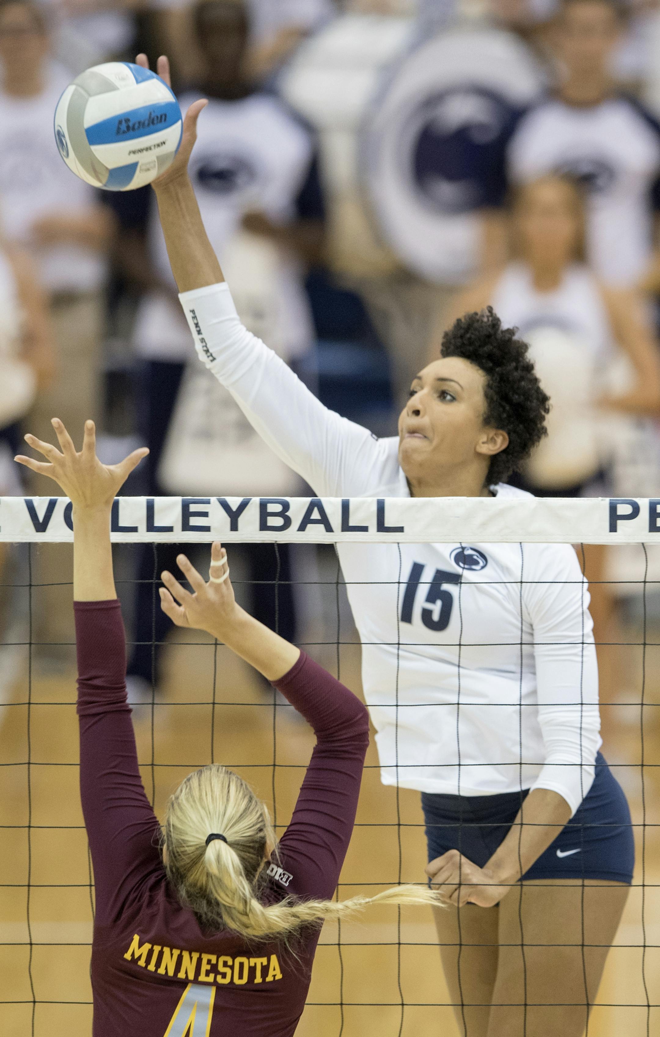 Penn State's Haleigh Washington )15) hits the ball over Minnesota's Paige Tapp during a match on Wednesday, Oct. 5, 2016, at Rec Hall in University Park, Pa. (Abby Drey/Centre Daily Times/TNS)