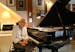 Herb Pilhofer sat at his piano at his home where he is preparing for an upcoming comeback as a jazz pianist with a gig at Crooners.