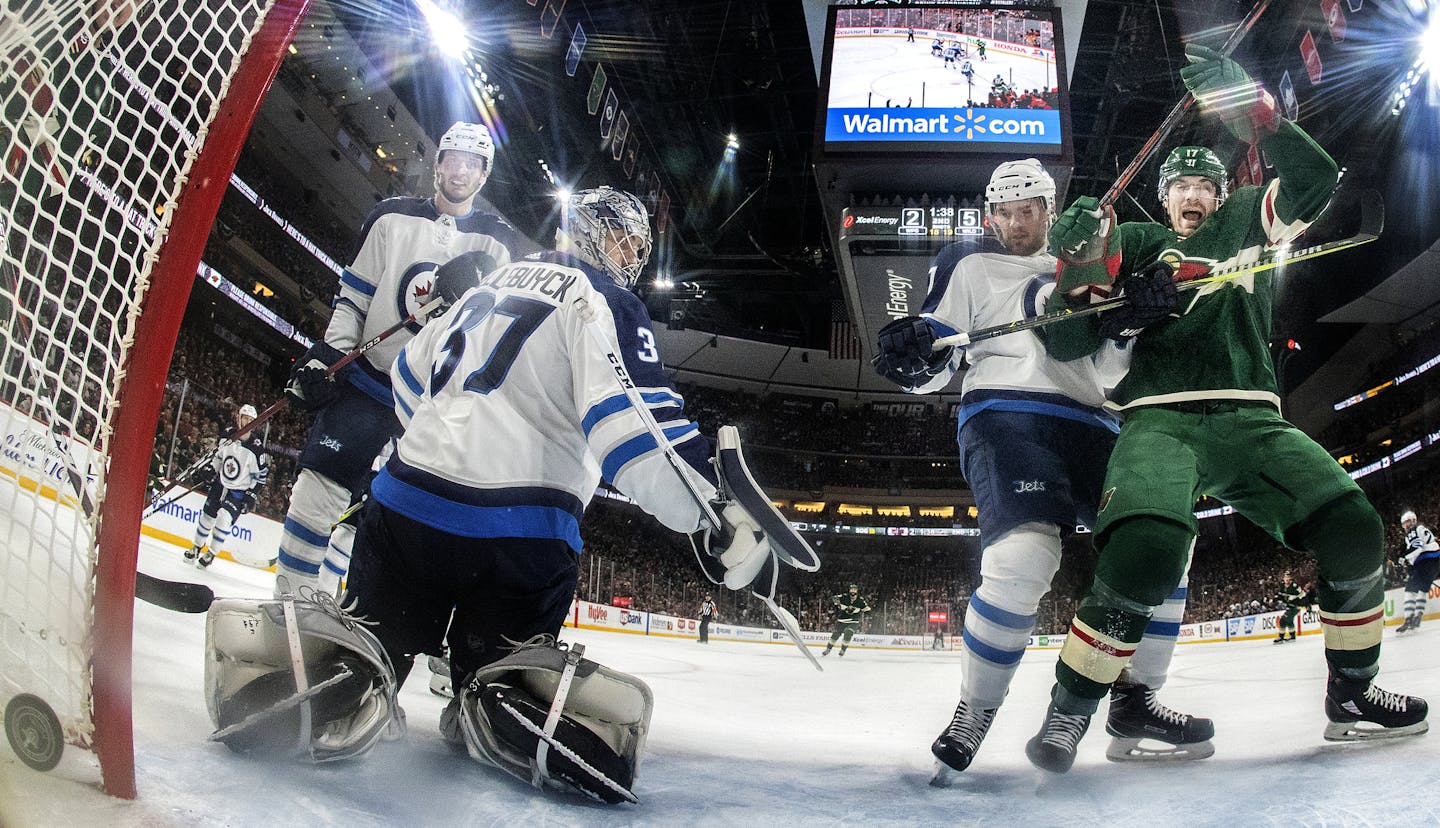 Marcus Foligno (17) celebrated after shooting the puck past Connor Hellebuyck (37) for a goal in the second period. ] CARLOS GONZALEZ &#xef; cgonzalez@startribune.com &#xf1; April 15, 2018, St. Paul, MN, Xcel Energy Center, NHL, Stanley Cup Playoffs &#xf1; Game 3, Minnesota Wild vs. Winnipeg Jets