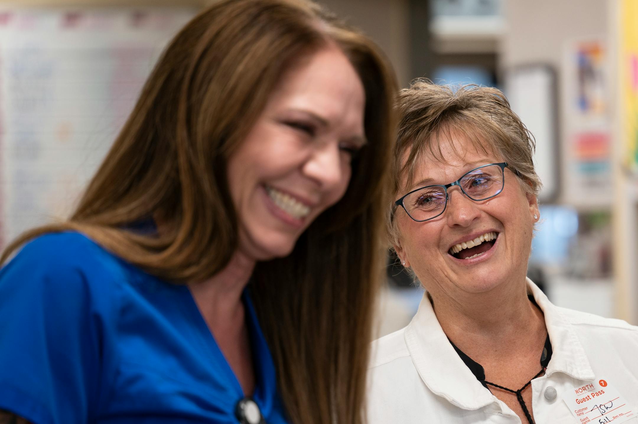 Deb Ulrich shares a tearful laugh with critical care nurse Amy Berwald Thursday, May 11, 2023, at North Memorial Health Hospital in Robbinsdale, Minn.