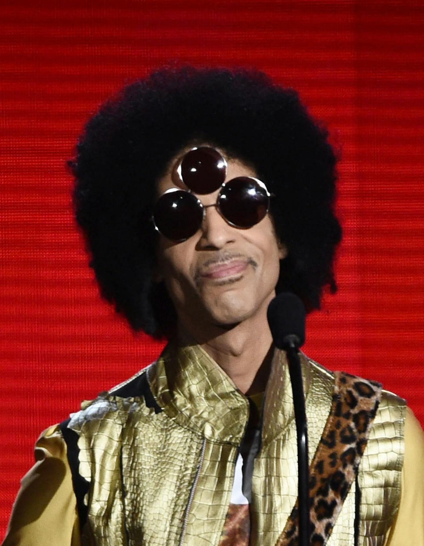 Prince, wearing glasses designed by Minnesota-born designers Corianna and Brianna Dotson.