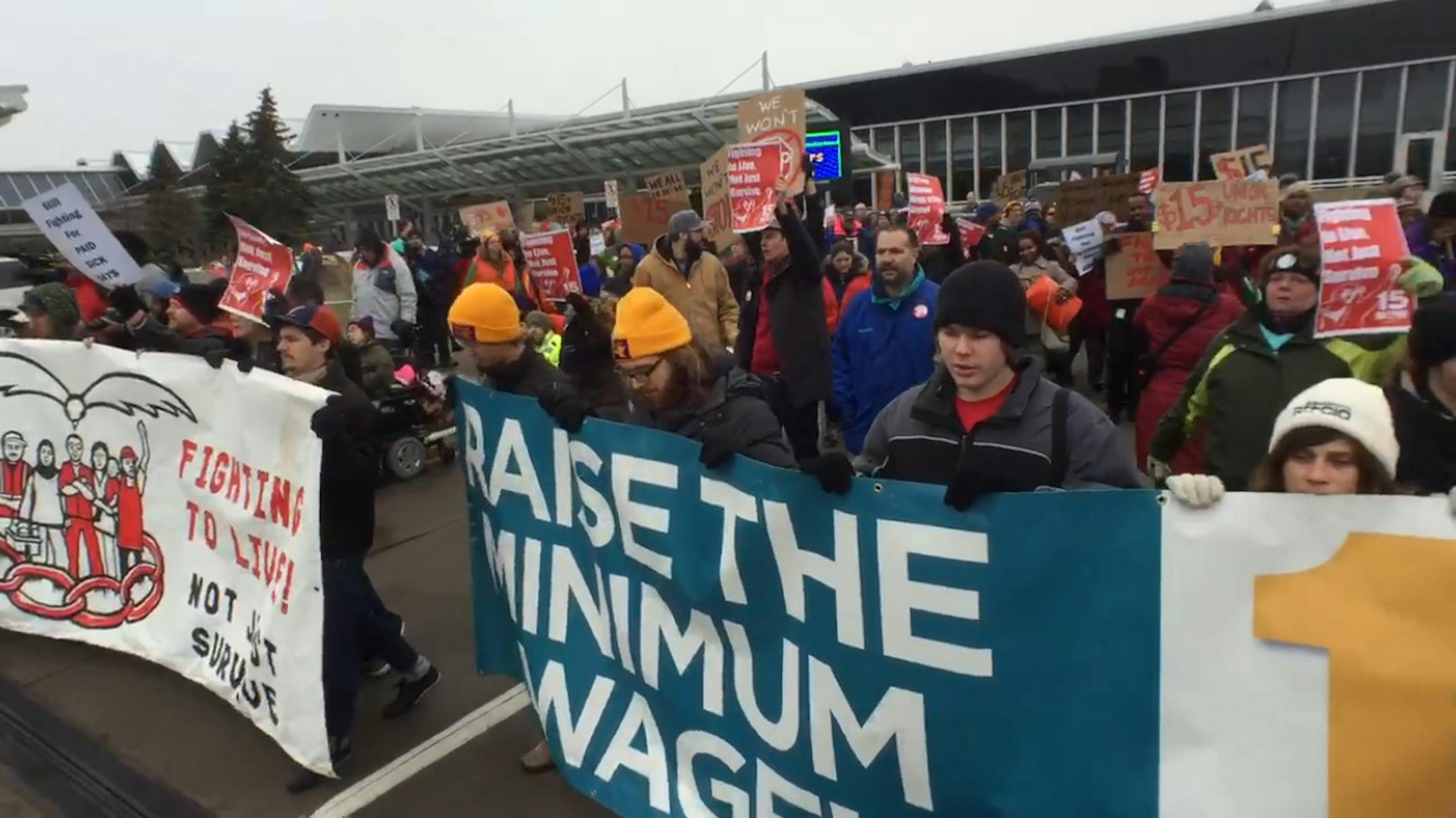 A group of people protesting over minimum wage laws at the Minneapolis-St. Paul International Airport on Friday, Dec. 5, 2014 blocked a roadway at Terminal 1 for a short time. (Brian Peterson/Star Tribune)
