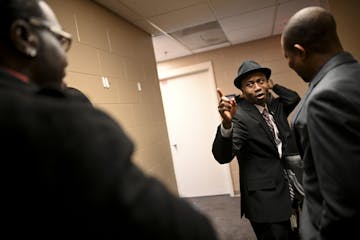 Erik Anderson, left, of Trenton, New Jersey, was greeted by Brooklyn Center Mayor Mike Elliot before Elliot's inauguration ceremony Wednesday night.