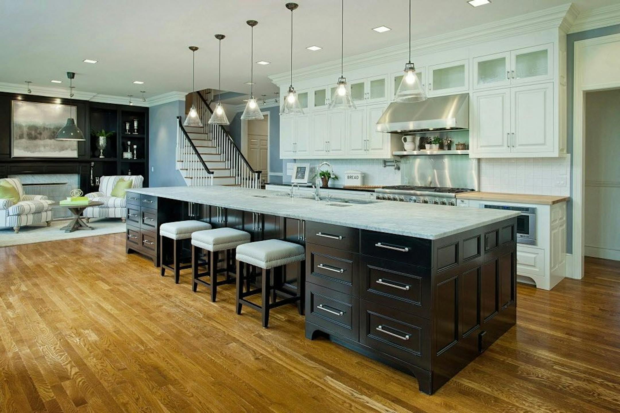 The newly-remodeled kitchen includes a hearth room and fireplace.