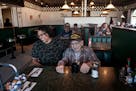 World War II veteran Dan Rankin, 95, shares a laugh with Maria Baker, manager of Dueling Irons restaurant in Post Falls, on Friday, May 10, 2019. Cust